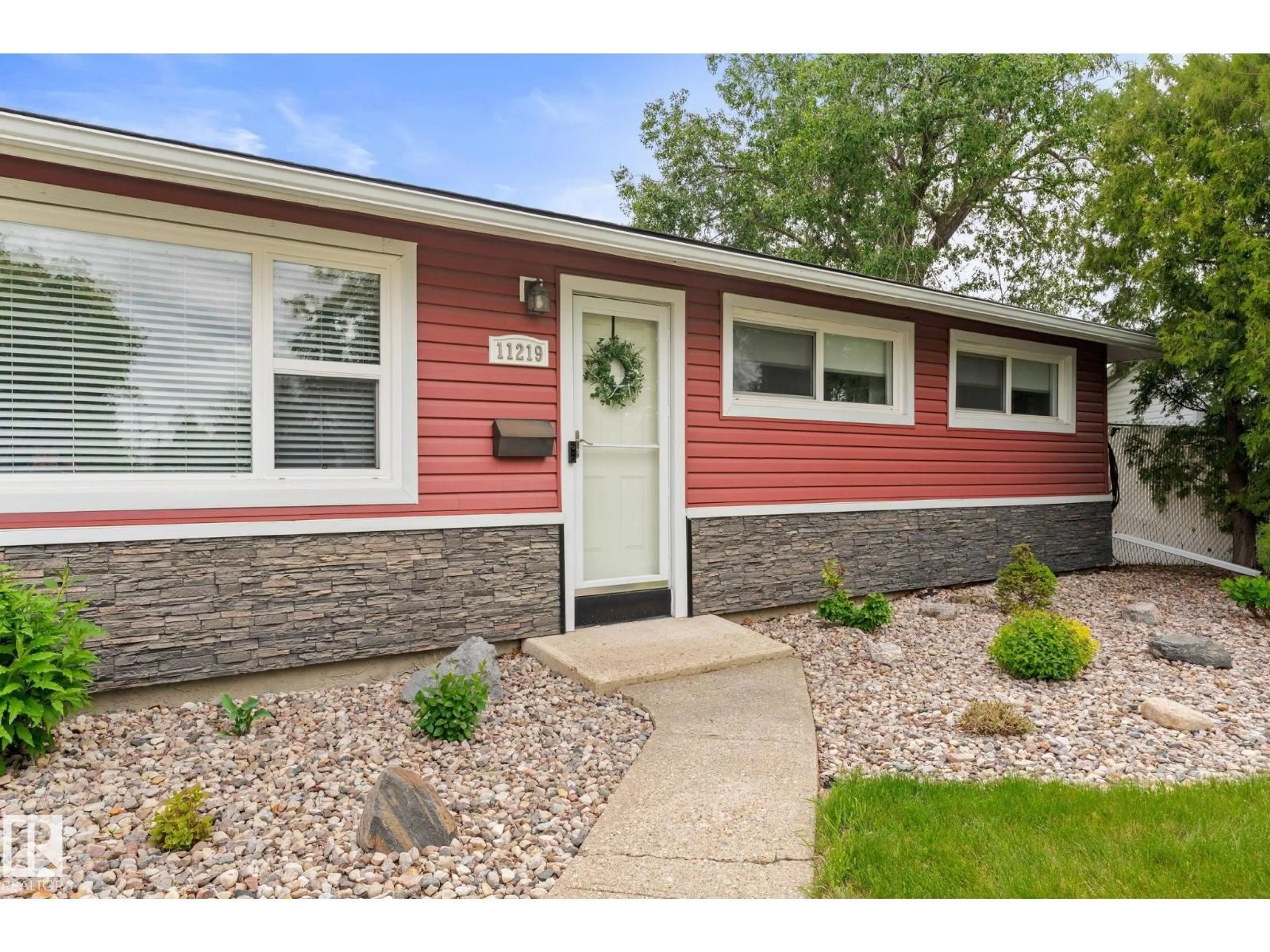 Home with vinyl exterior material, street for NW - 11219 134A AV, Edmonton Alberta T5E1M4