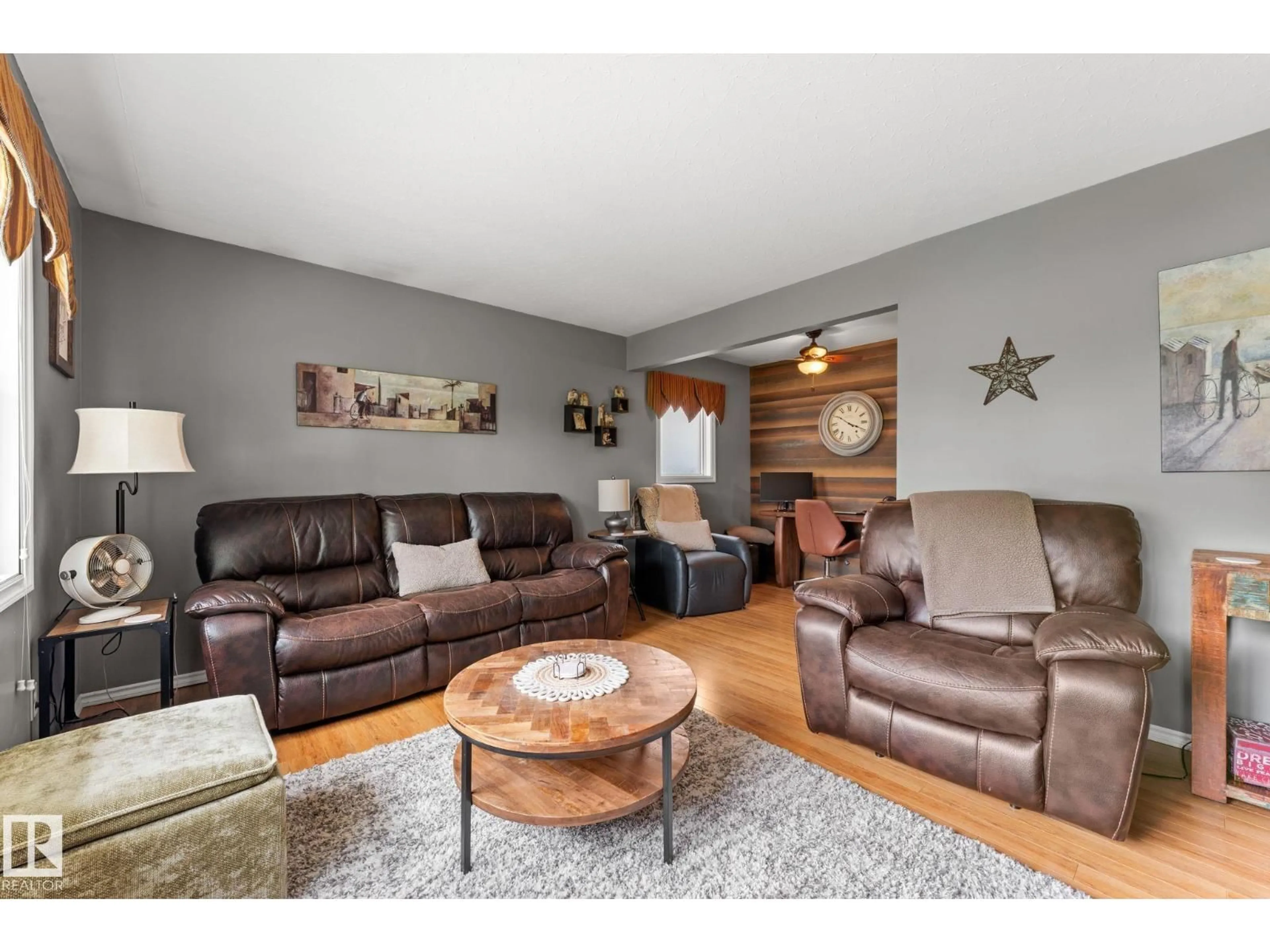 Living room with furniture, wood/laminate floor for NW - 11219 134A AV, Edmonton Alberta T5E1M4