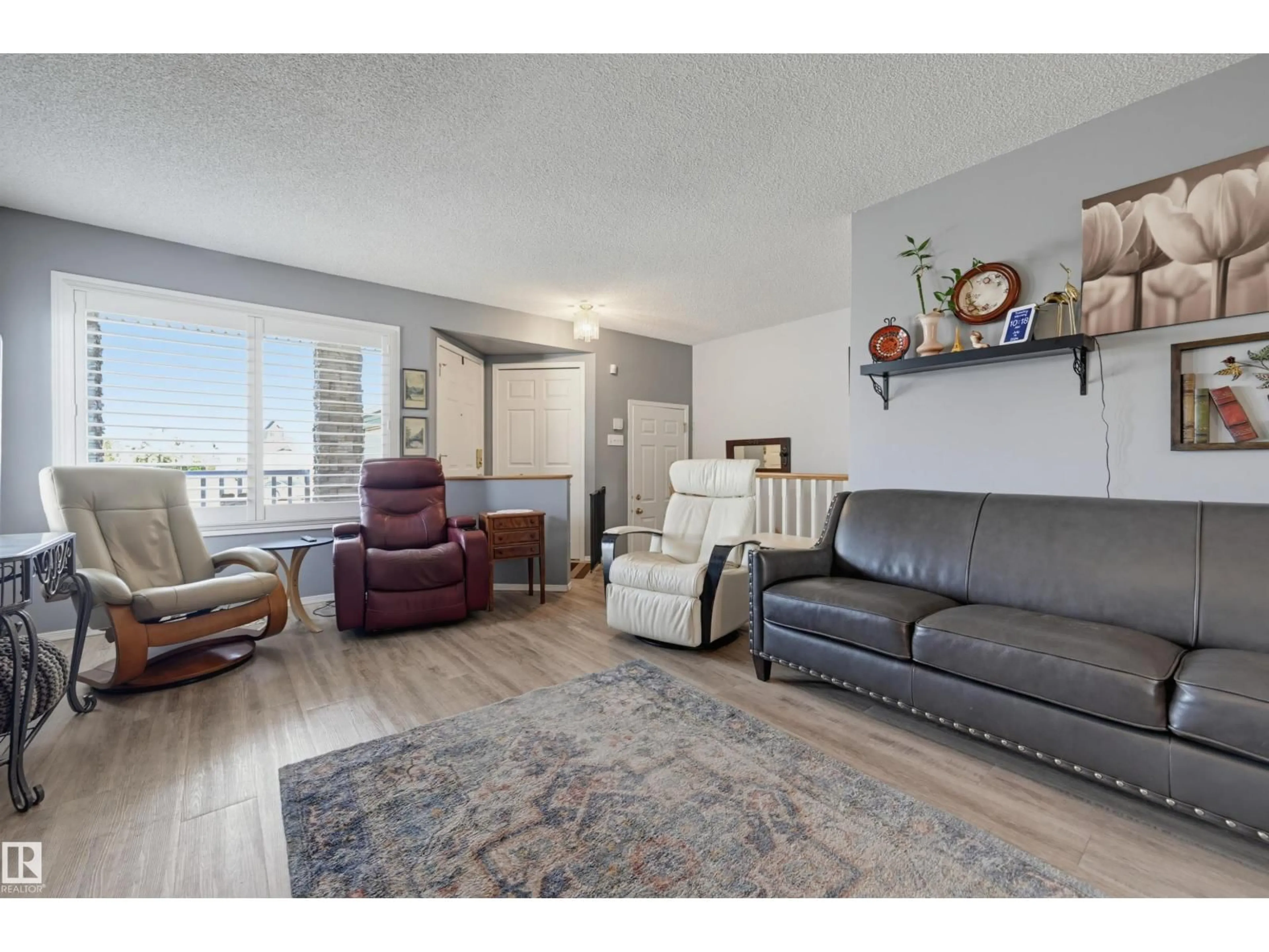 Living room with furniture, wood/laminate floor for 14903 128 ST, Edmonton Alberta T6V1E9