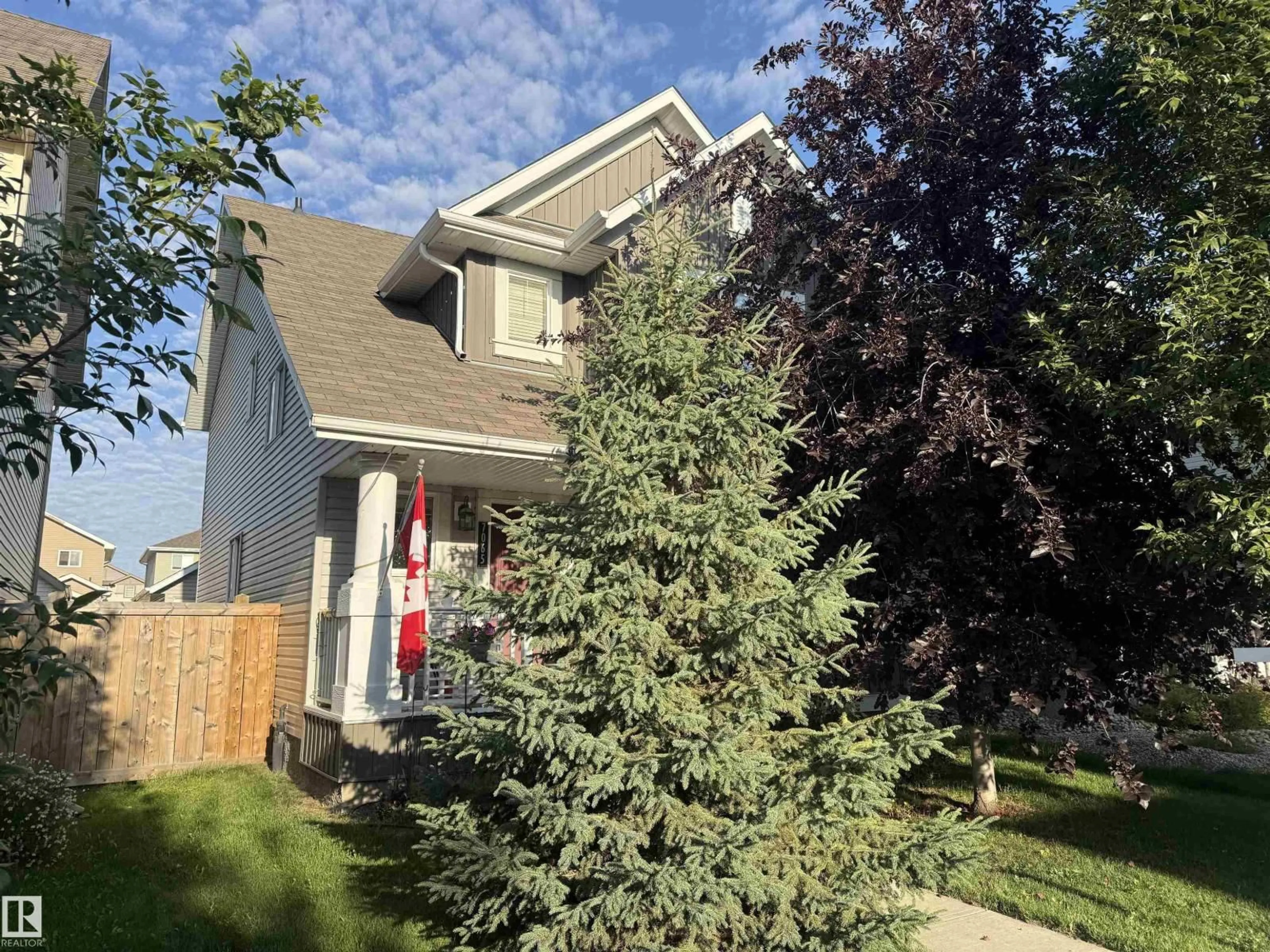 Home with vinyl exterior material, street for 7065 CARDINAL WY, Edmonton Alberta T6W1Z2