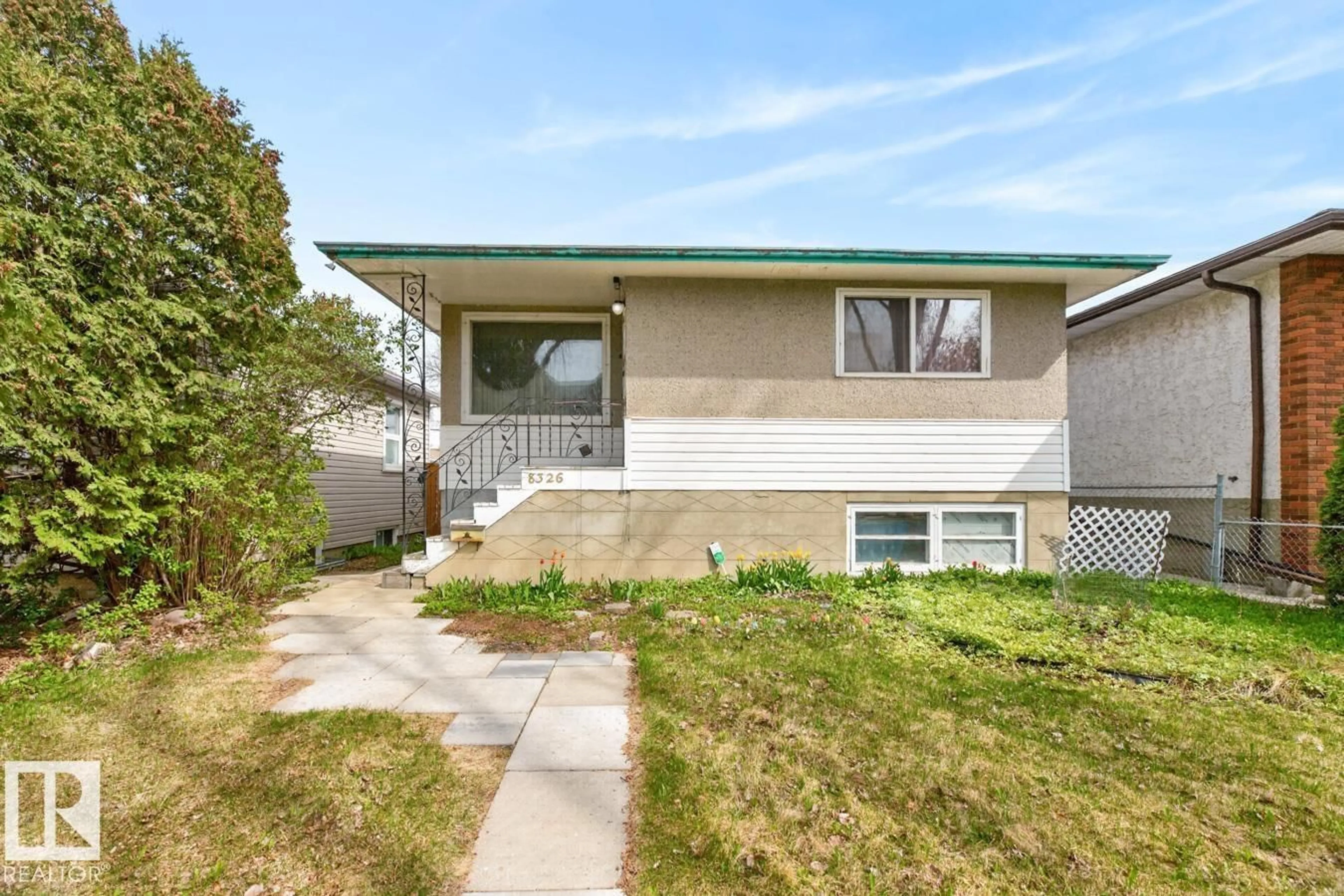 Home with vinyl exterior material, street for 8326 81 AV, Edmonton Alberta T6C0W2