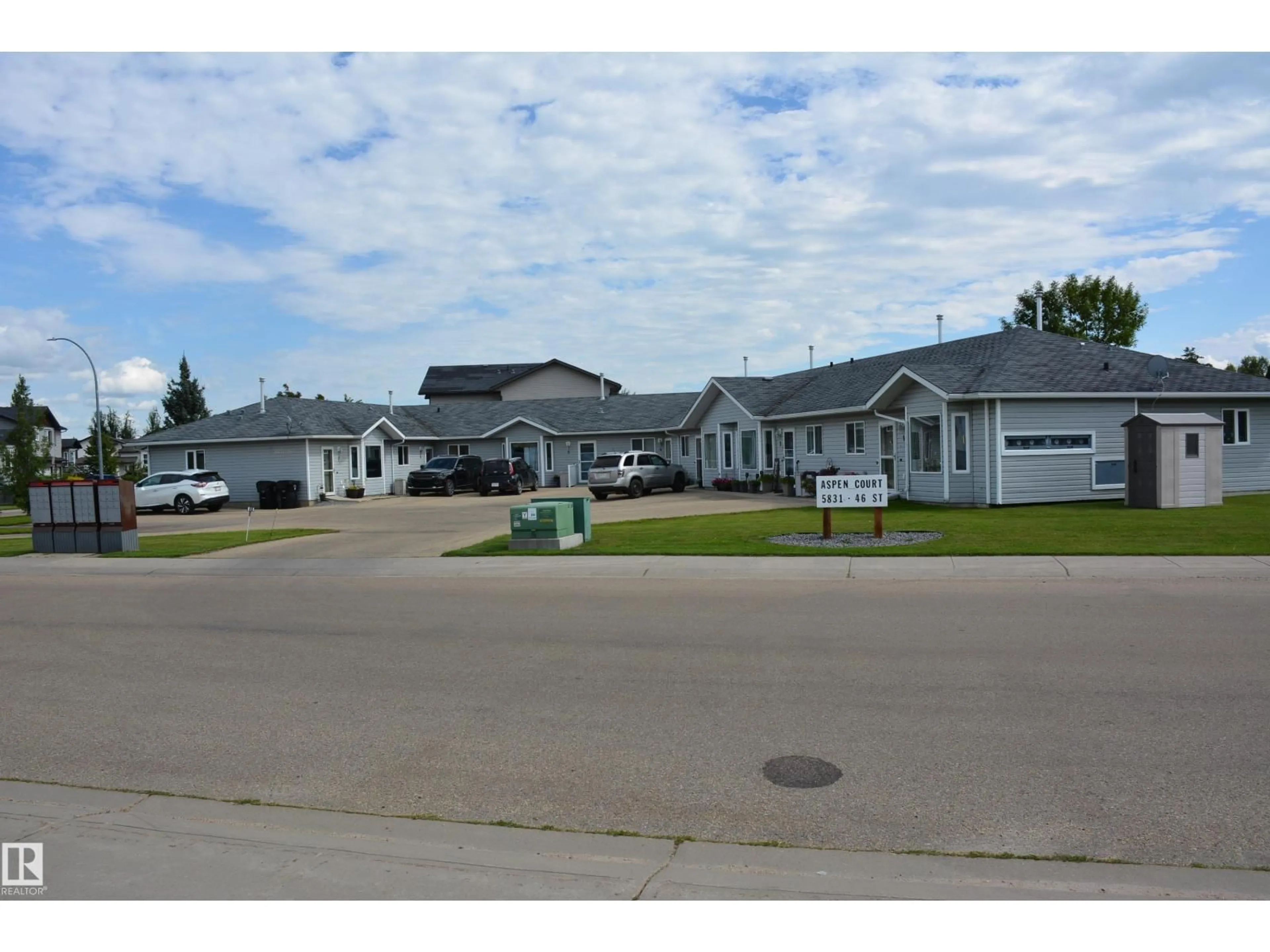 A pic from outside/outdoor area/front of a property/back of a property/a pic from drone, street for 5 - 5831 46 ST, Barrhead Alberta T7N7N0