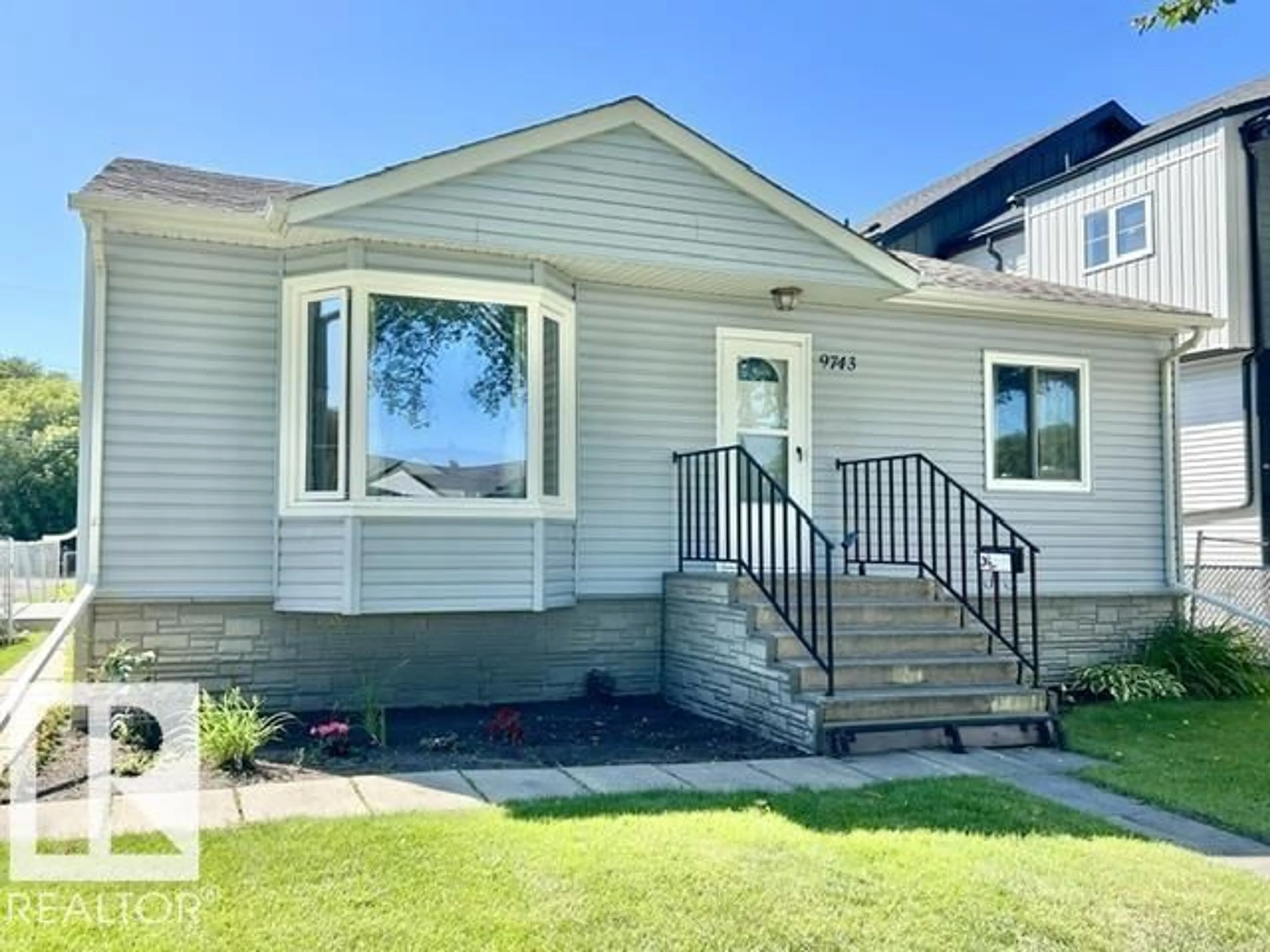 Home with vinyl exterior material, street for 9743 65 AV, Edmonton Alberta T6E0K5