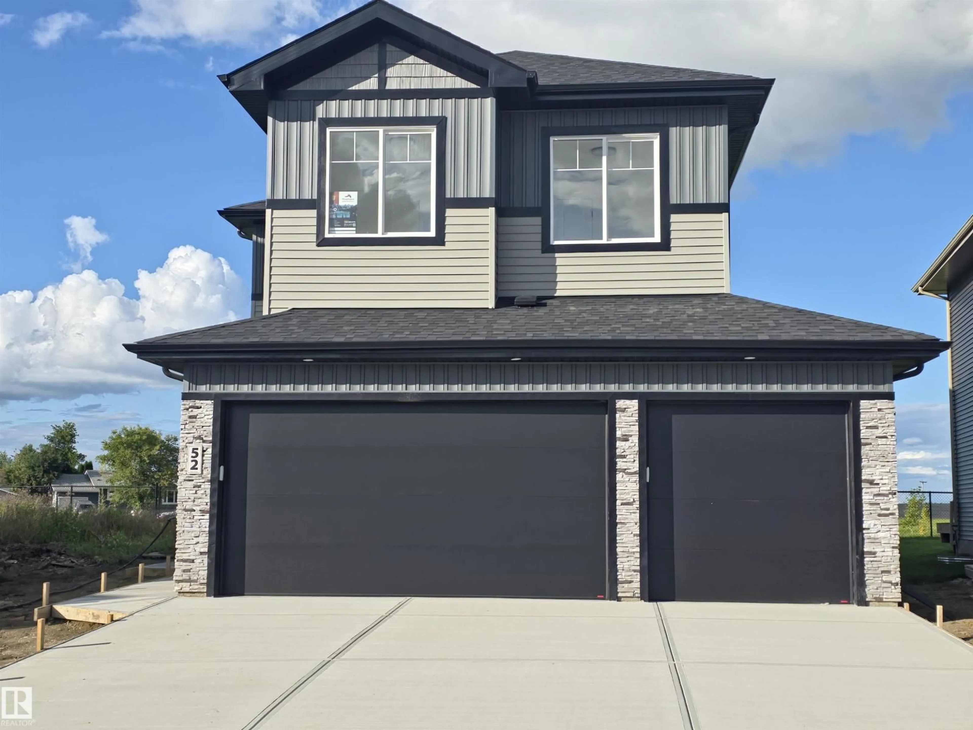 Home with vinyl exterior material, street for SE - 52 MAPLE CR, Gibbons Alberta T0A1N0