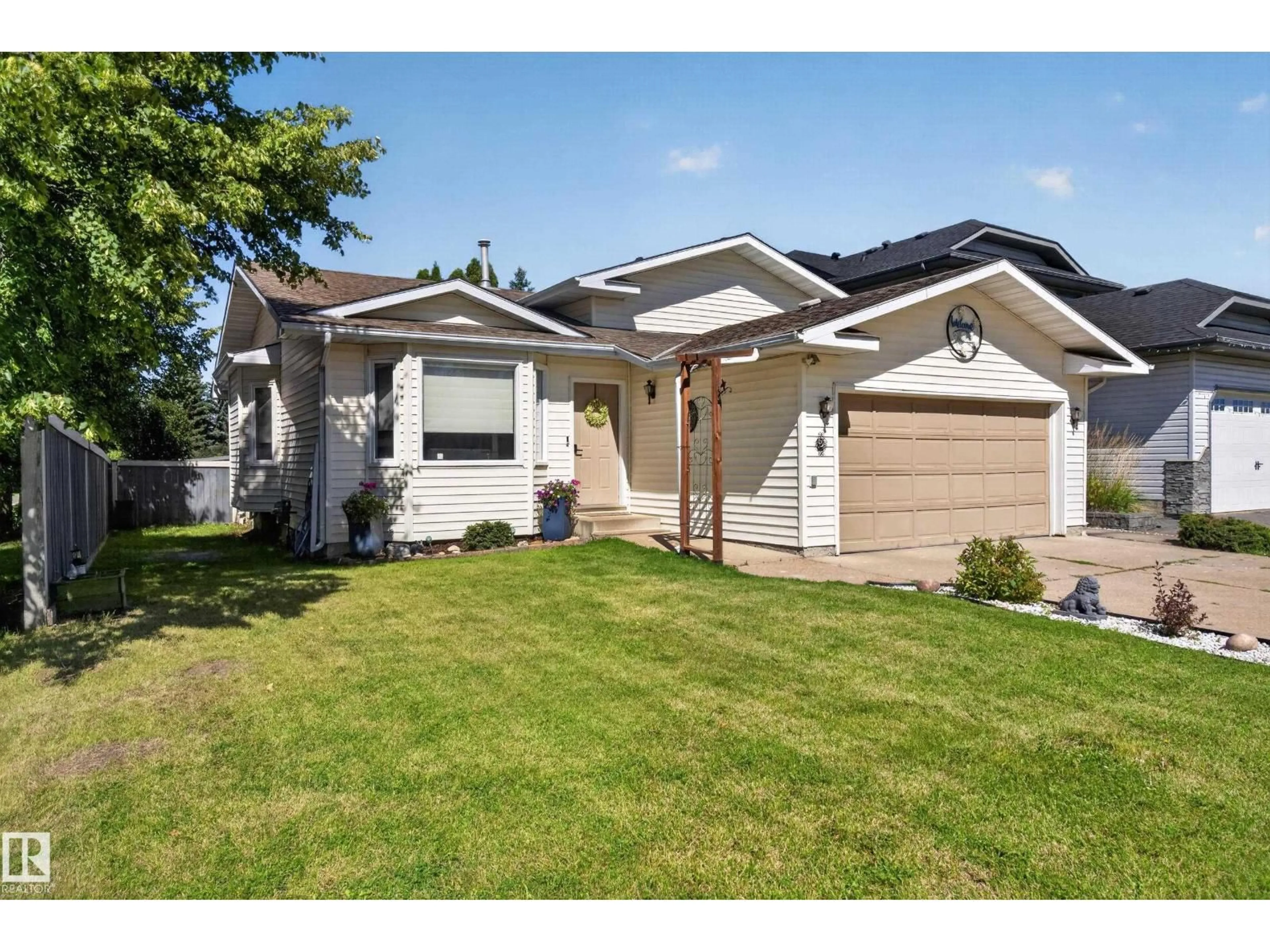 Home with vinyl exterior material, street for 2 WOODSIDE CR, Spruce Grove Alberta T7X3E5