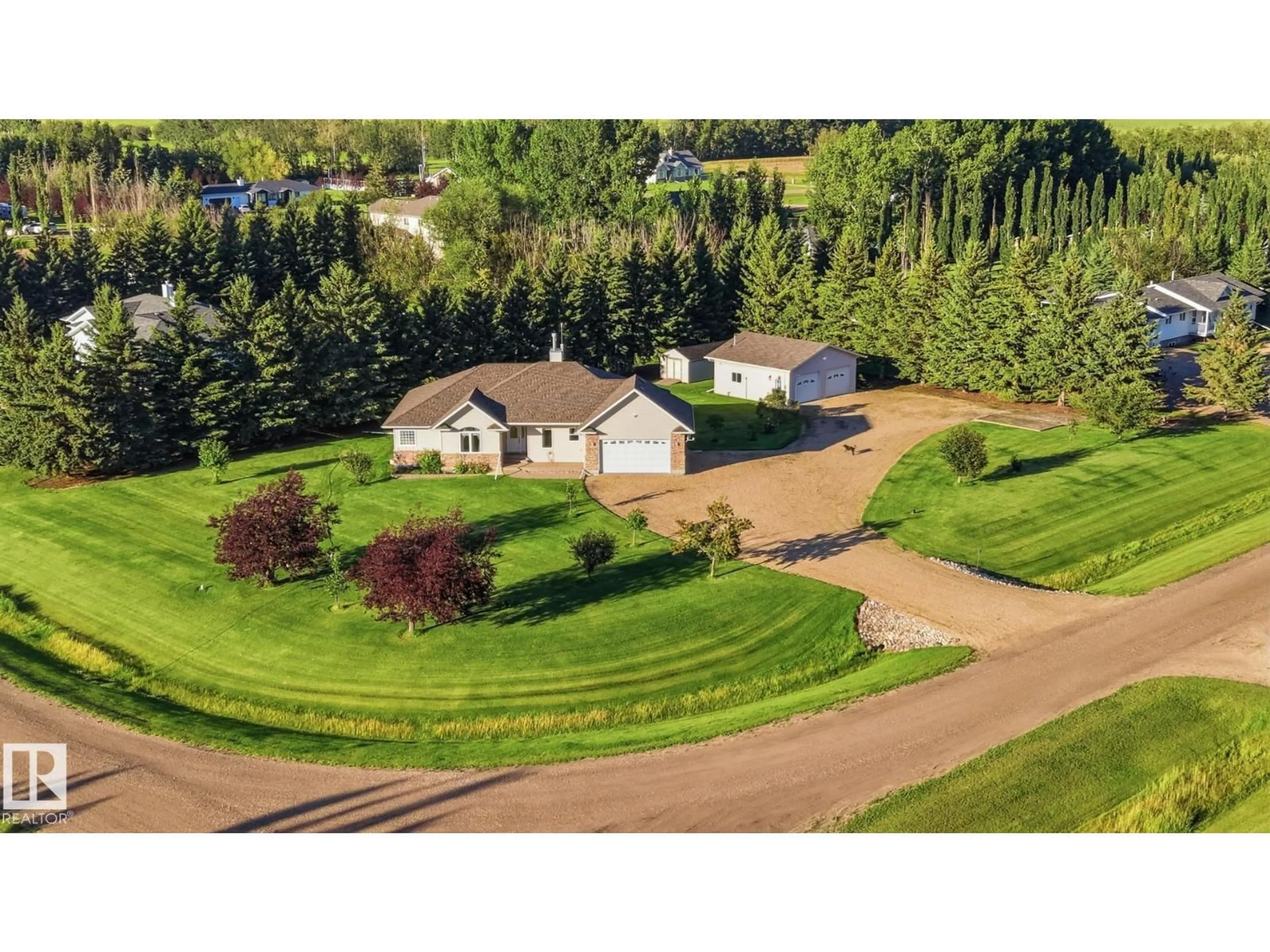A pic from outside/outdoor area/front of a property/back of a property/a pic from drone, unknown for 11 - 27118 HWY 18, Rural Westlock County Alberta T7P2P6