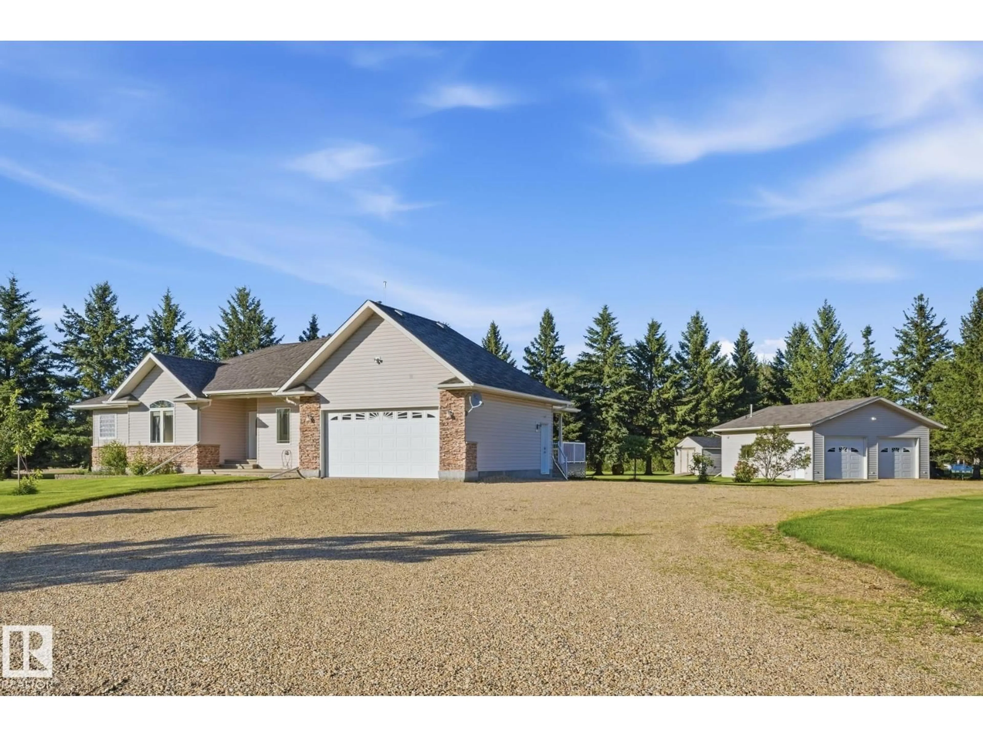A pic from outside/outdoor area/front of a property/back of a property/a pic from drone, street for 11 - 27118 HWY 18, Rural Westlock County Alberta T7P2P6