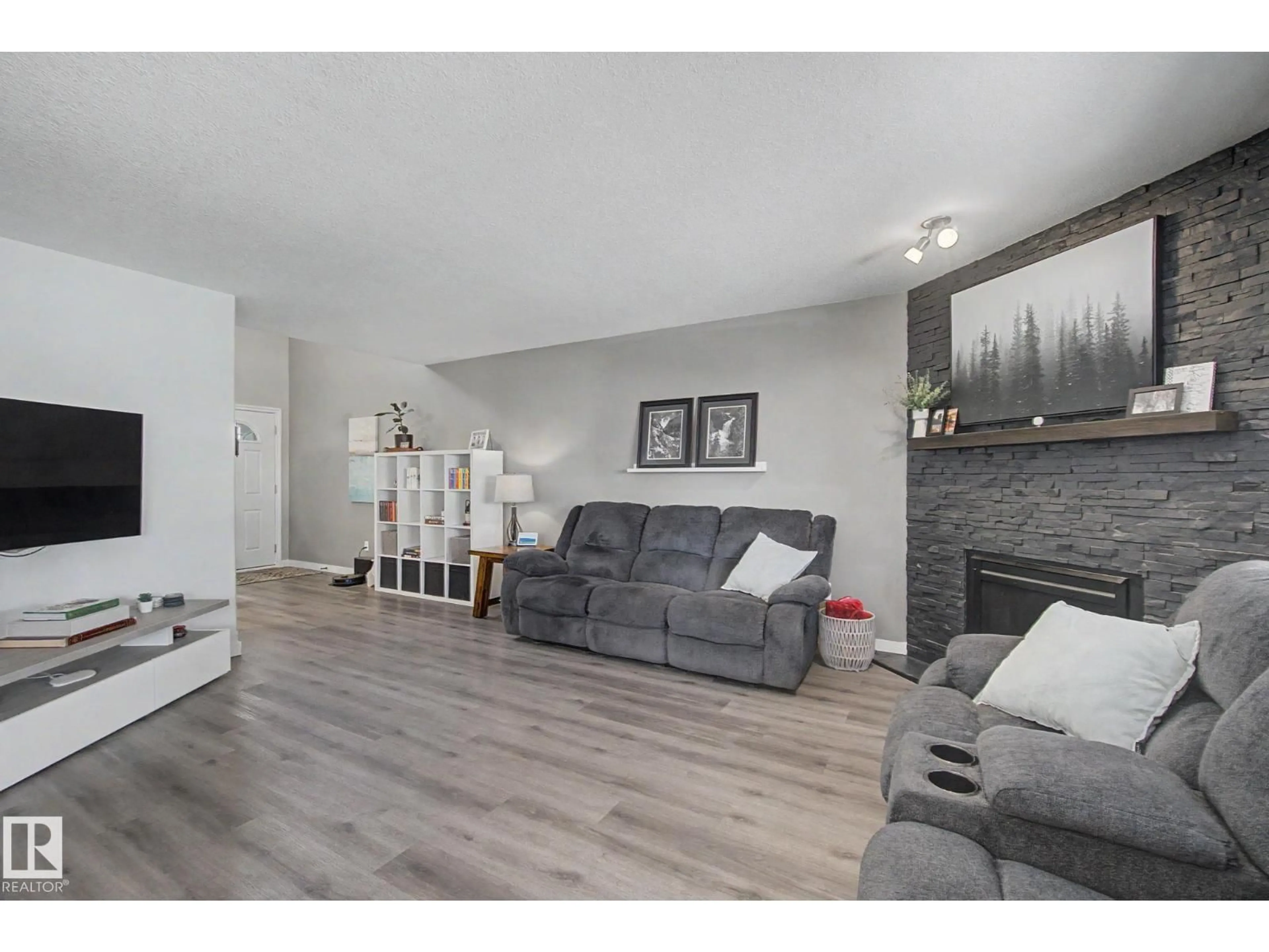Living room with furniture, wood/laminate floor for 172 GALLOWAY WD, Fort Saskatchewan Alberta T8L0B9