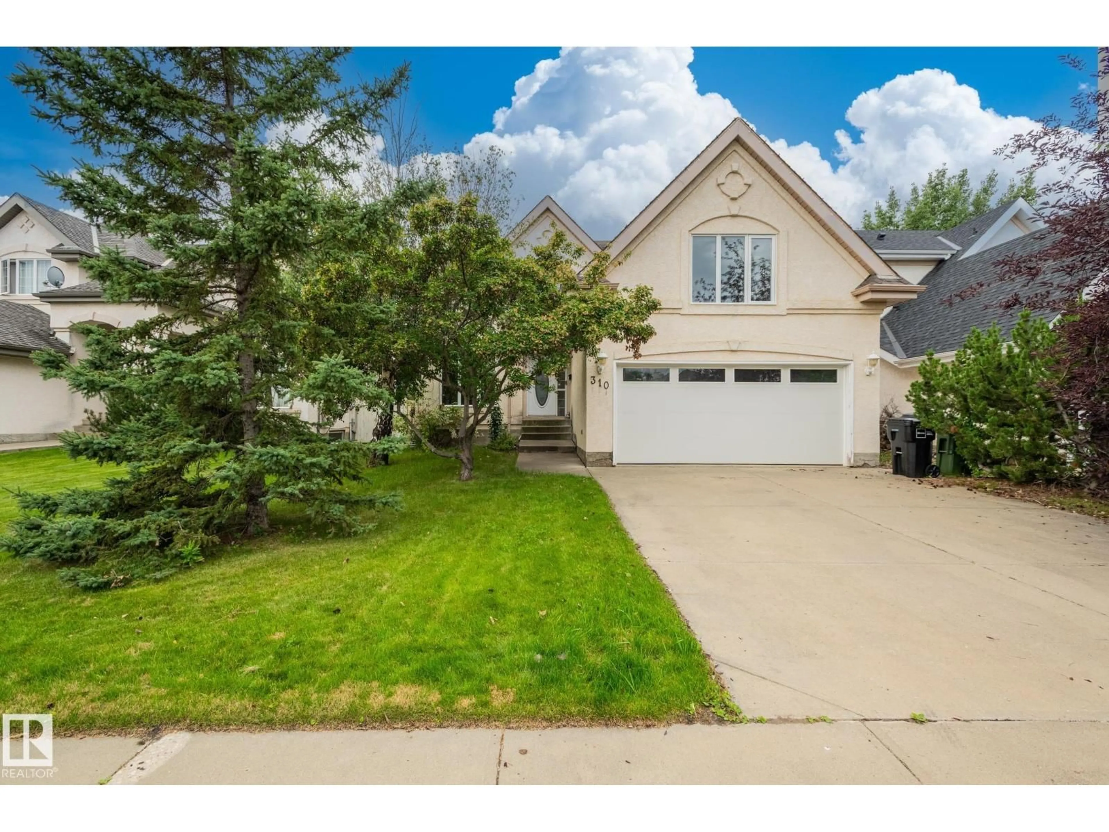 Home with vinyl exterior material, street for NW - 310 LIVINGSTONE CO, Edmonton Alberta T6R2T1