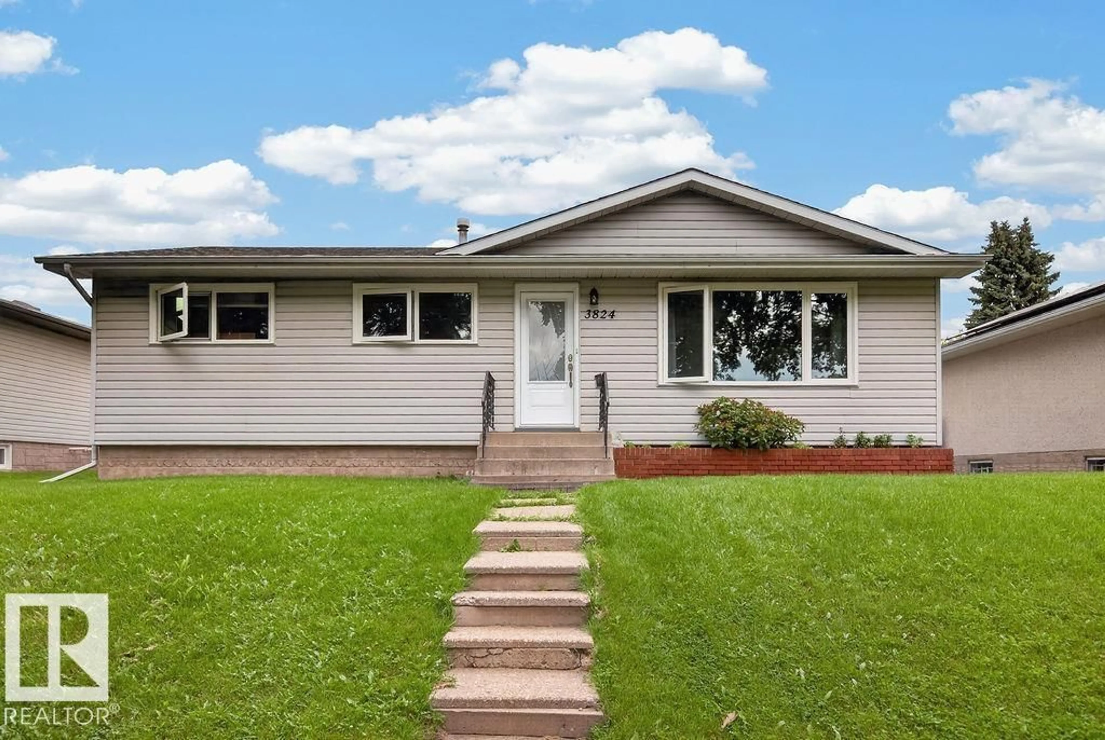 Home with vinyl exterior material, street for 3824 114 AV, Edmonton Alberta T5W0S6