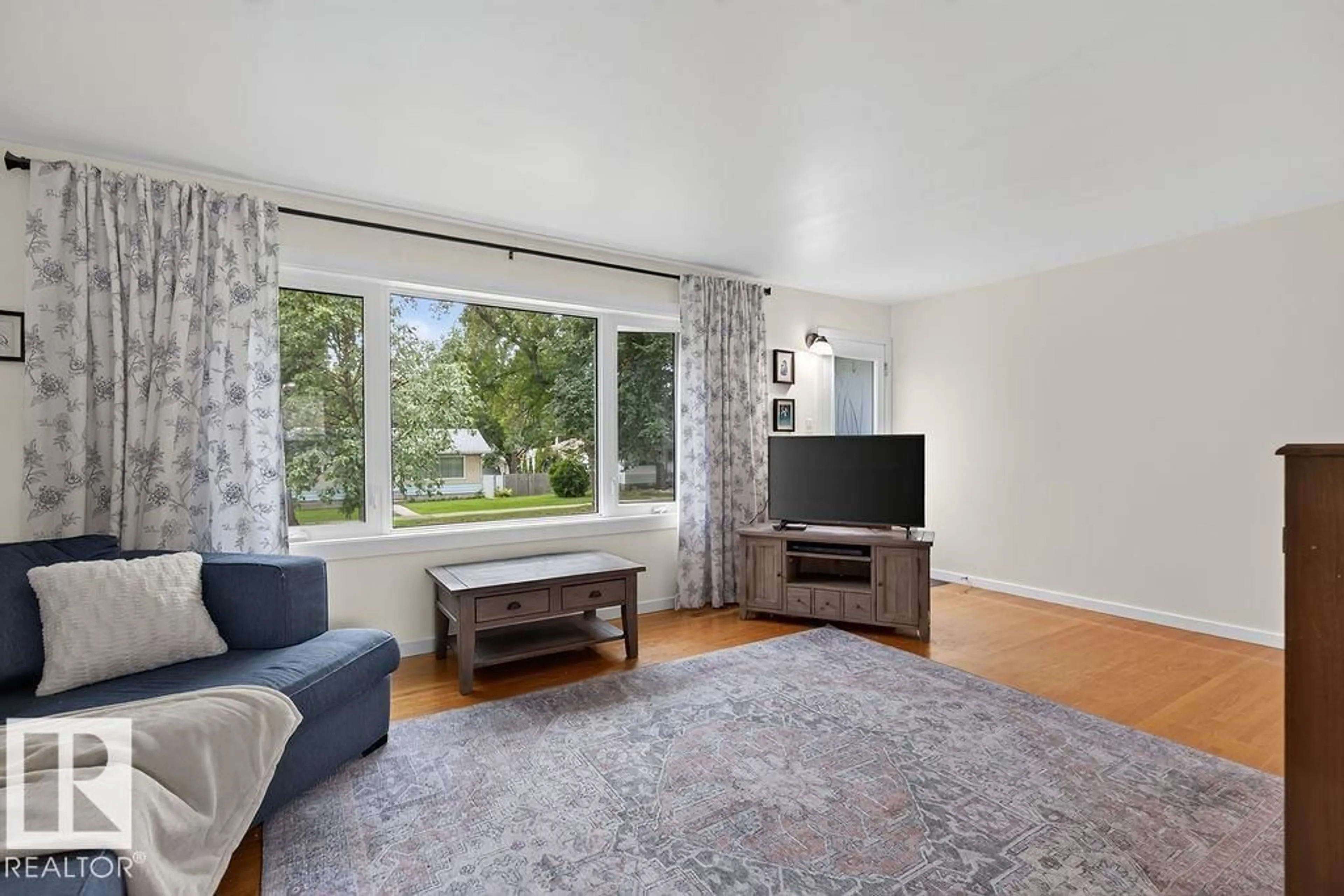Living room with furniture, unknown for 3824 114 AV, Edmonton Alberta T5W0S6
