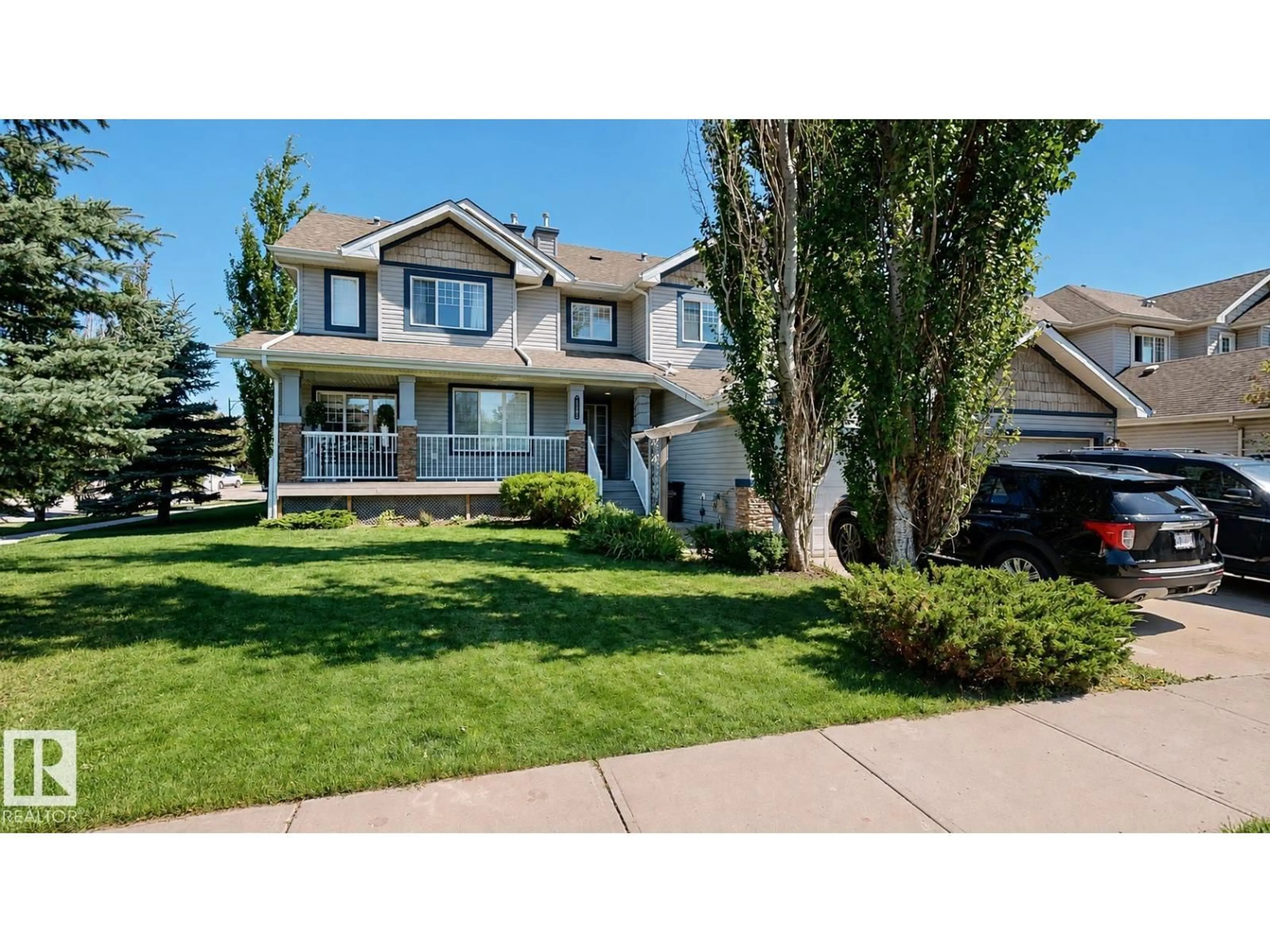 Home with vinyl exterior material, street for 1505 RUTHERFORD RD, Edmonton Alberta T6W1V9