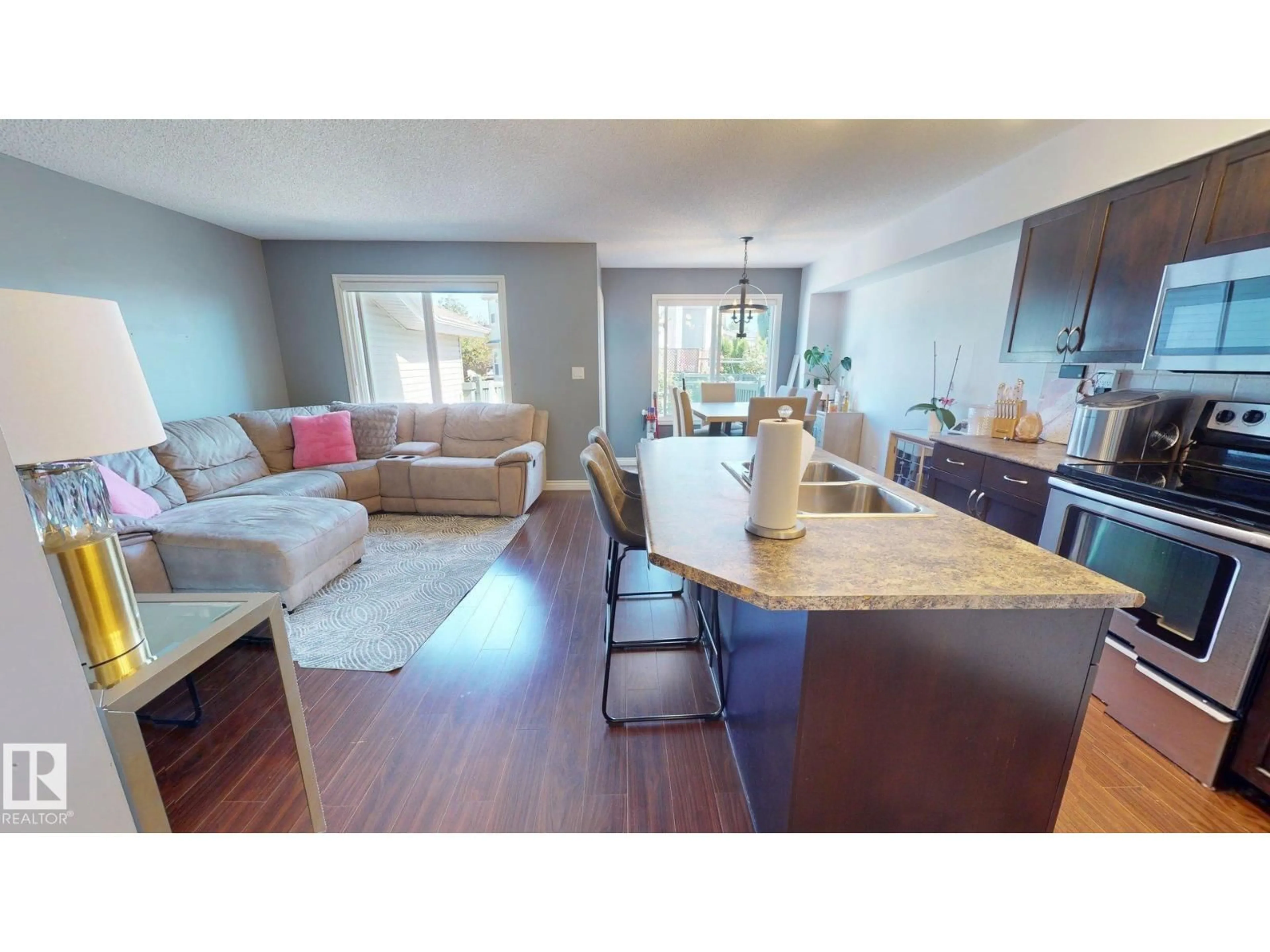 Open concept kitchen, wood/laminate floor for 1505 RUTHERFORD RD, Edmonton Alberta T6W1V9