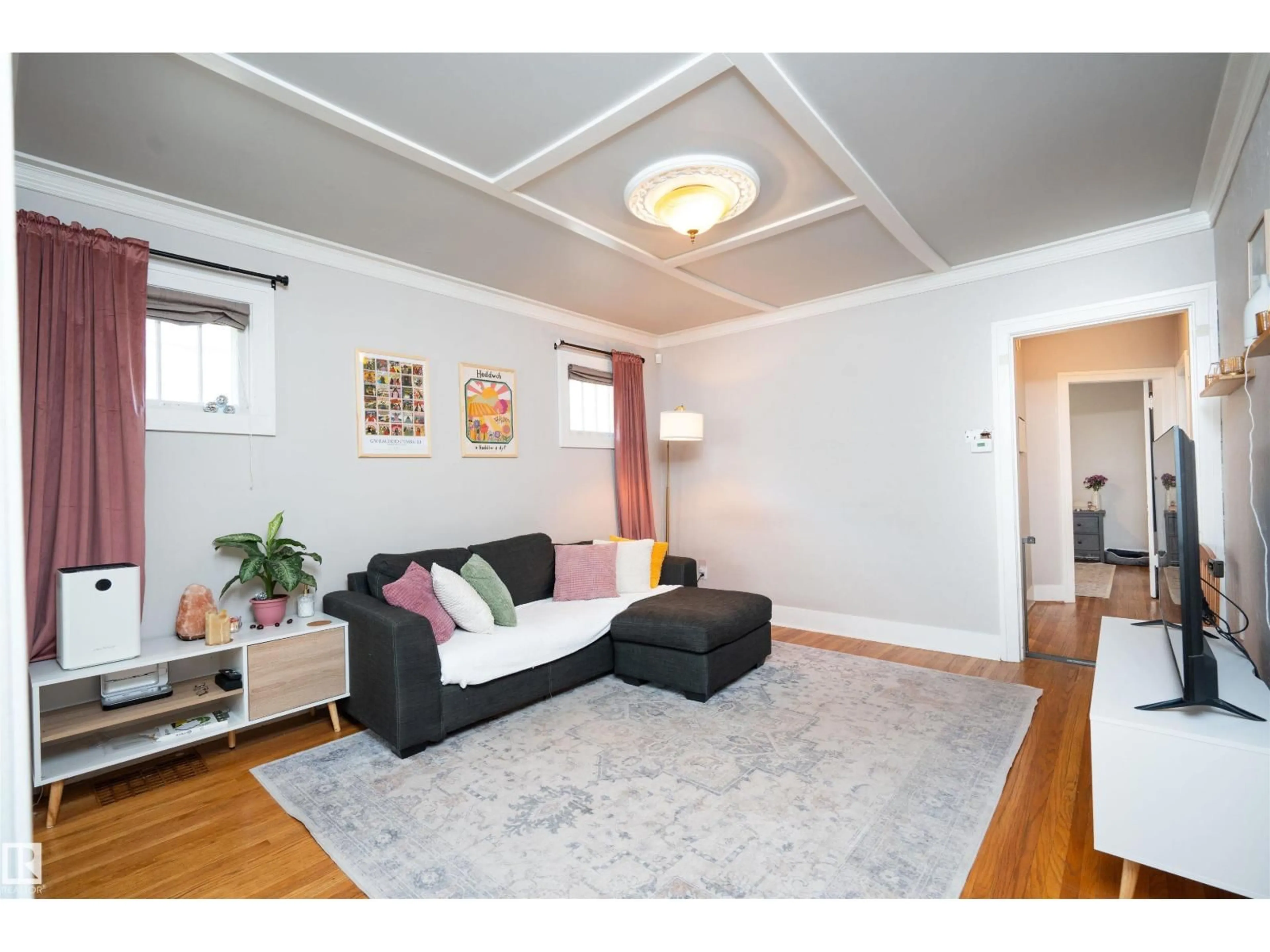 Living room with furniture, wood/laminate floor for 11506 94 ST, Edmonton Alberta T5G1H7