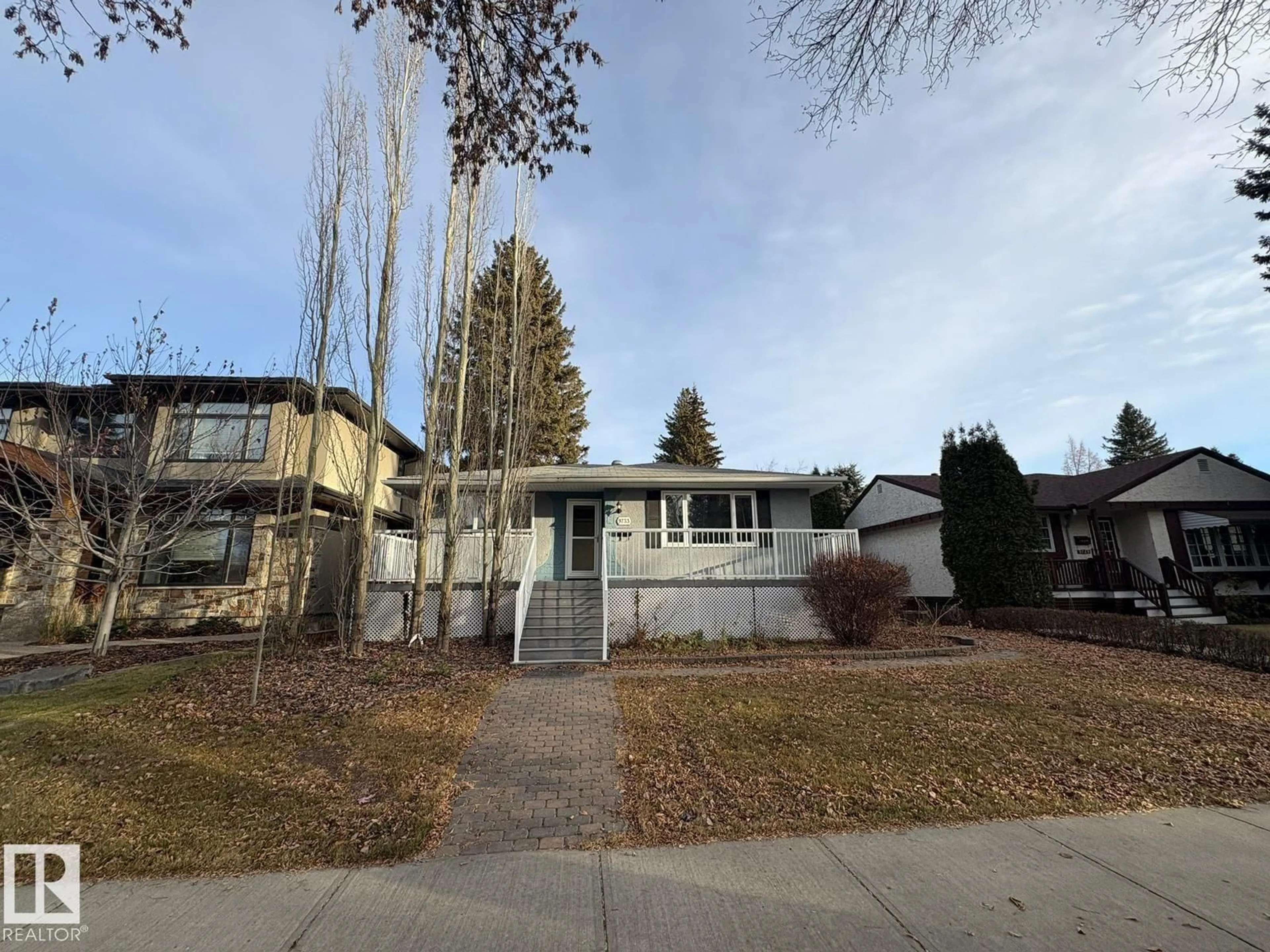 Home with vinyl exterior material, street for 9733 143 ST, Edmonton Alberta T5N2R3