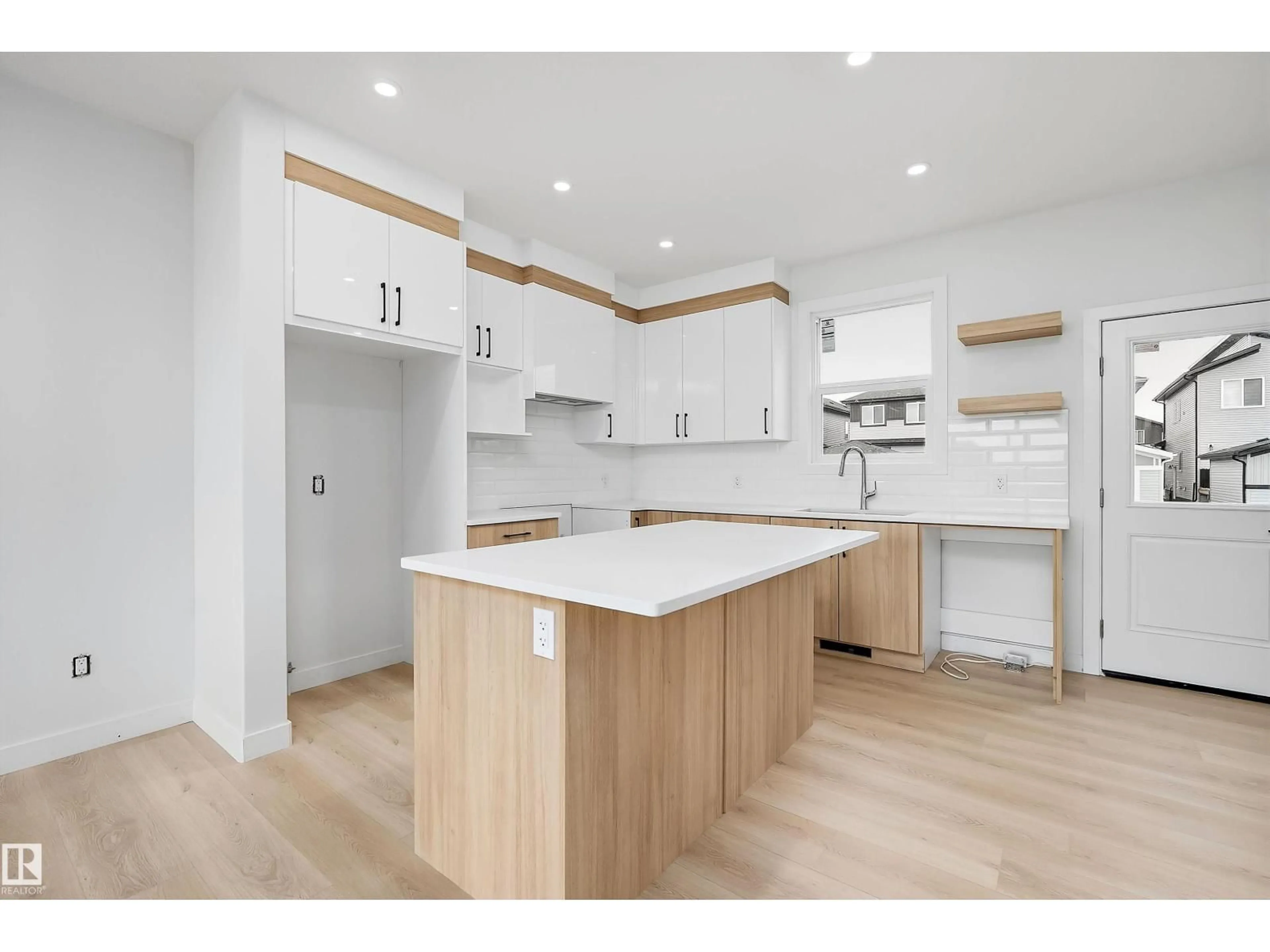 Open concept kitchen, wood/laminate floor for 525 ROBINSON BV, Leduc Alberta T9E1P8
