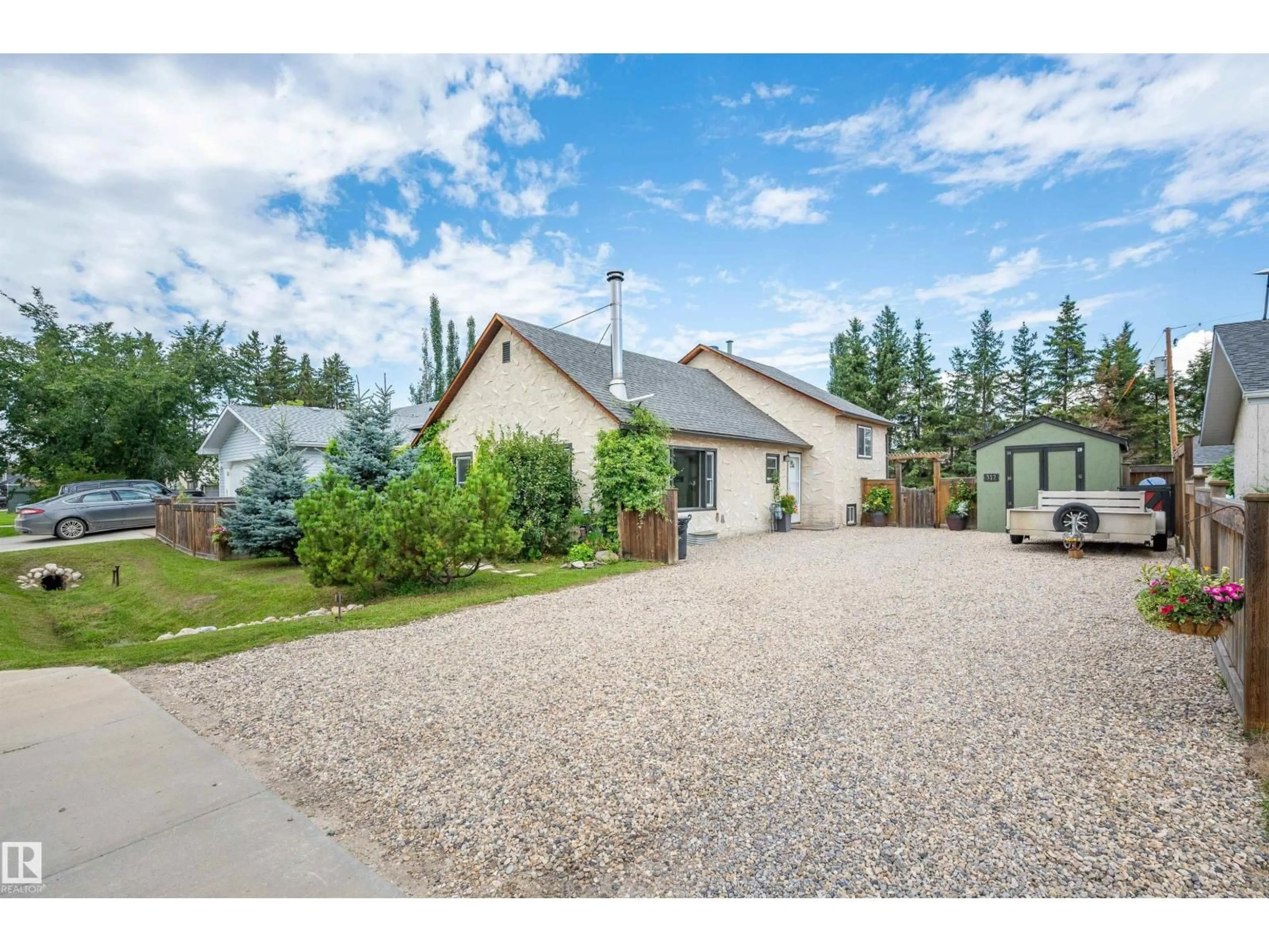 A pic from outside/outdoor area/front of a property/back of a property/a pic from drone, street for 312 - 25100 TWP ROAD 554, Cardiff Alberta T8R1P4