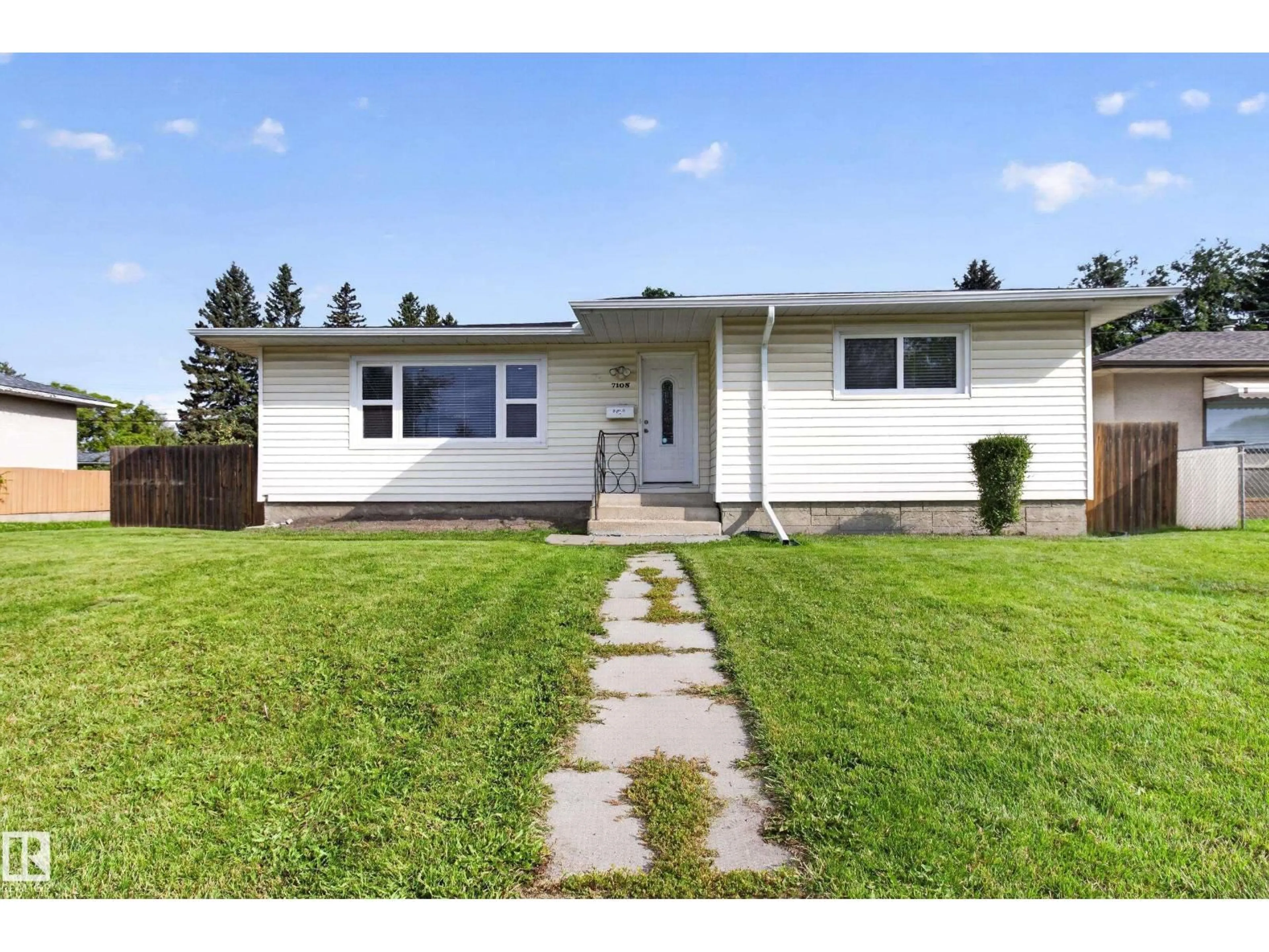 Home with vinyl exterior material, street for 7108 90 AV, Edmonton Alberta T6B0P4