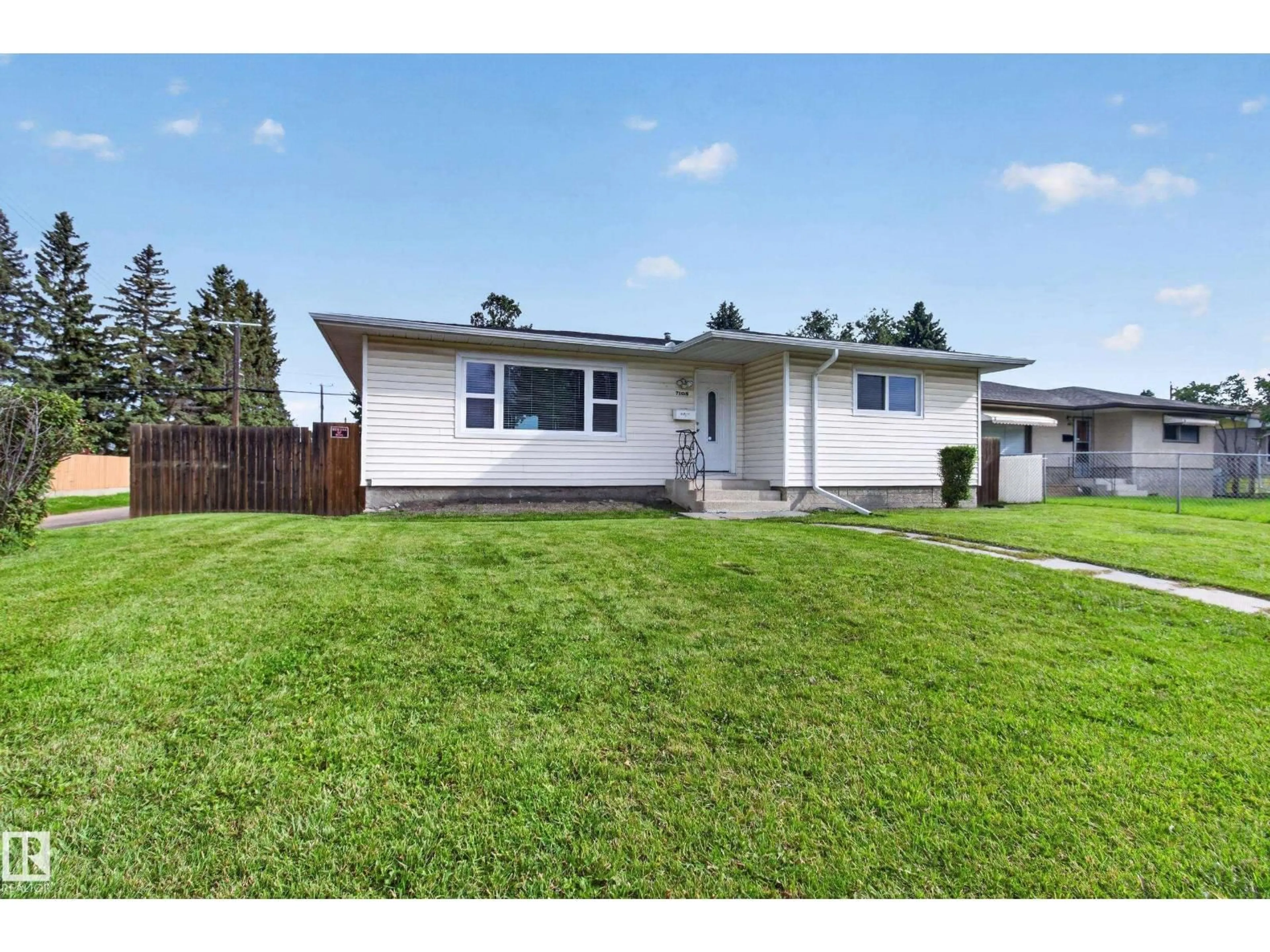 Home with vinyl exterior material, street for 7108 90 AV, Edmonton Alberta T6B0P4