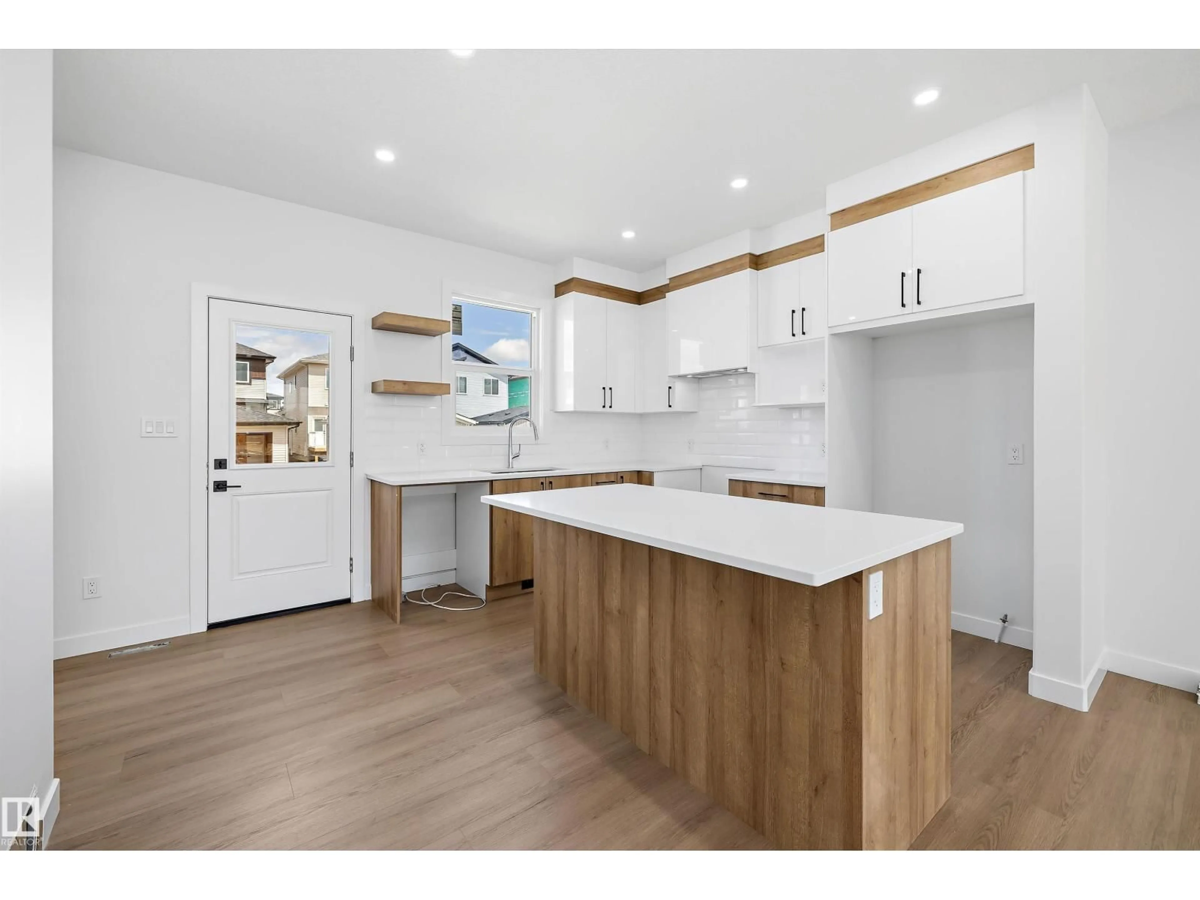 Open concept kitchen, wood/laminate floor for 523 ROBINSON BV, Leduc Alberta T9E1P8
