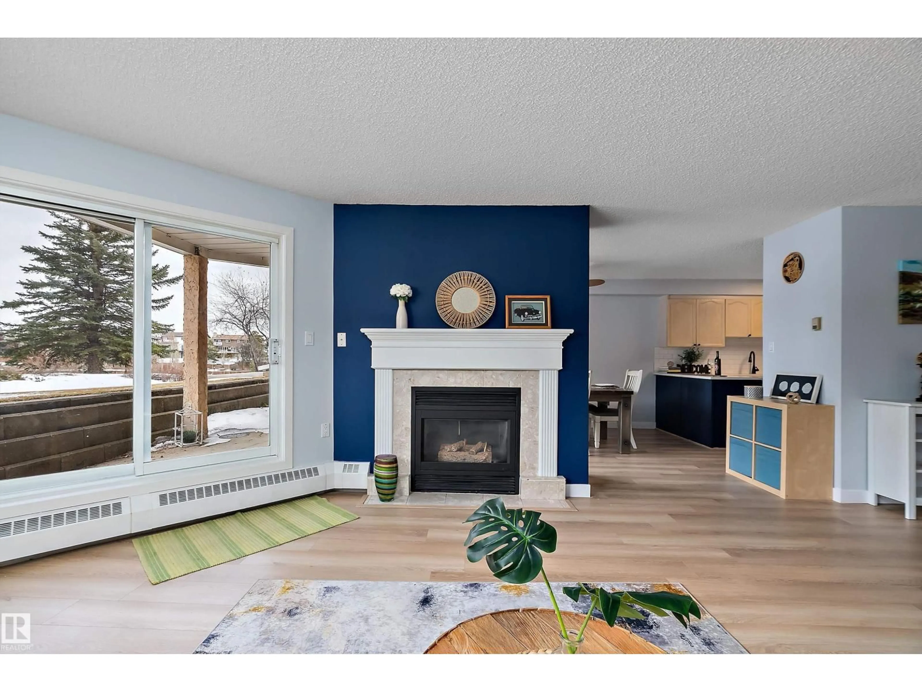 Living room with furniture, wood/laminate floor for 15499 - 124 CASTLE DOWNS RD, Edmonton Alberta T5X5Y3