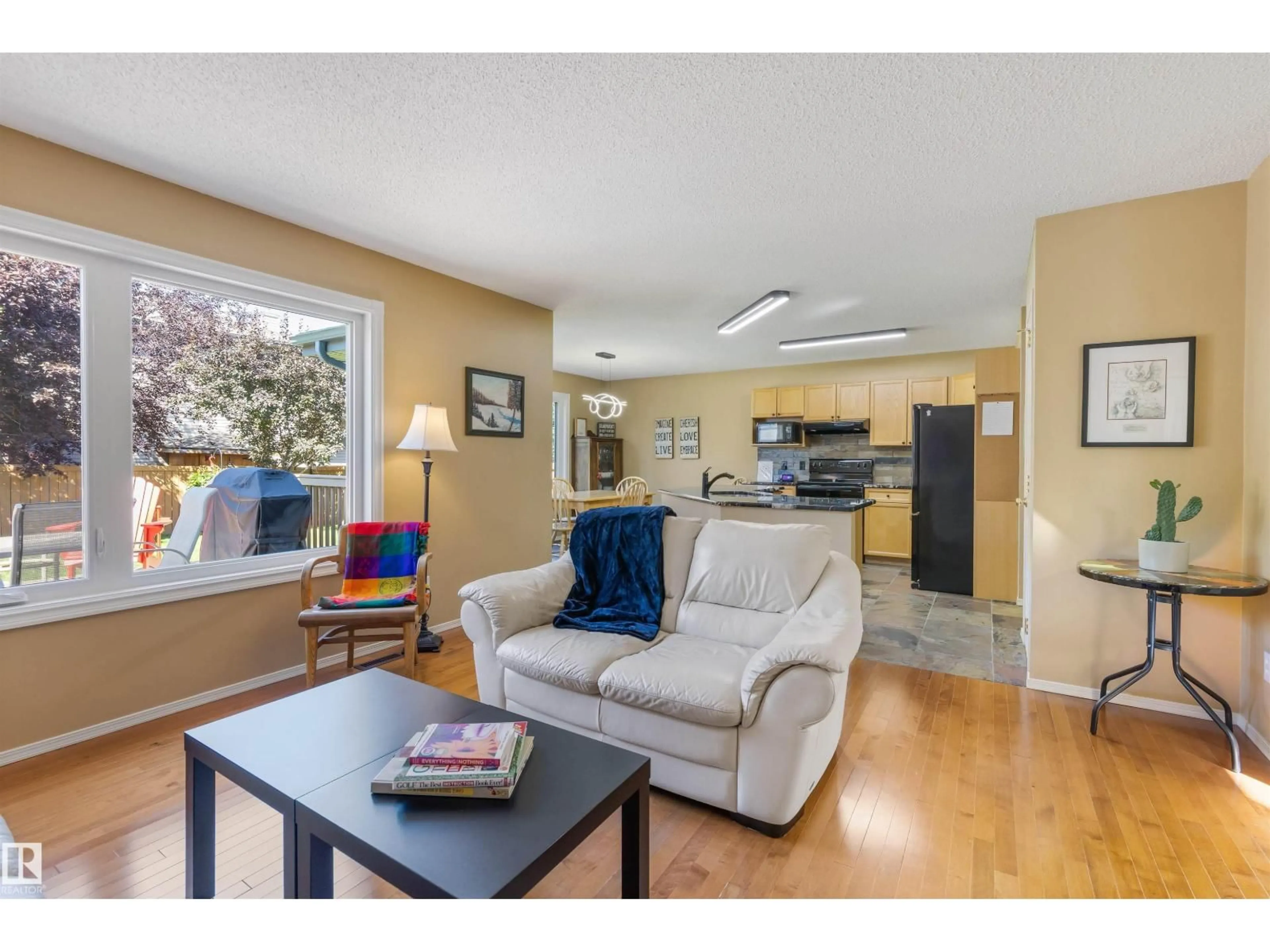 Living room with furniture, wood/laminate floor for 118 NAPLES WY, St. Albert Alberta T8N7E4