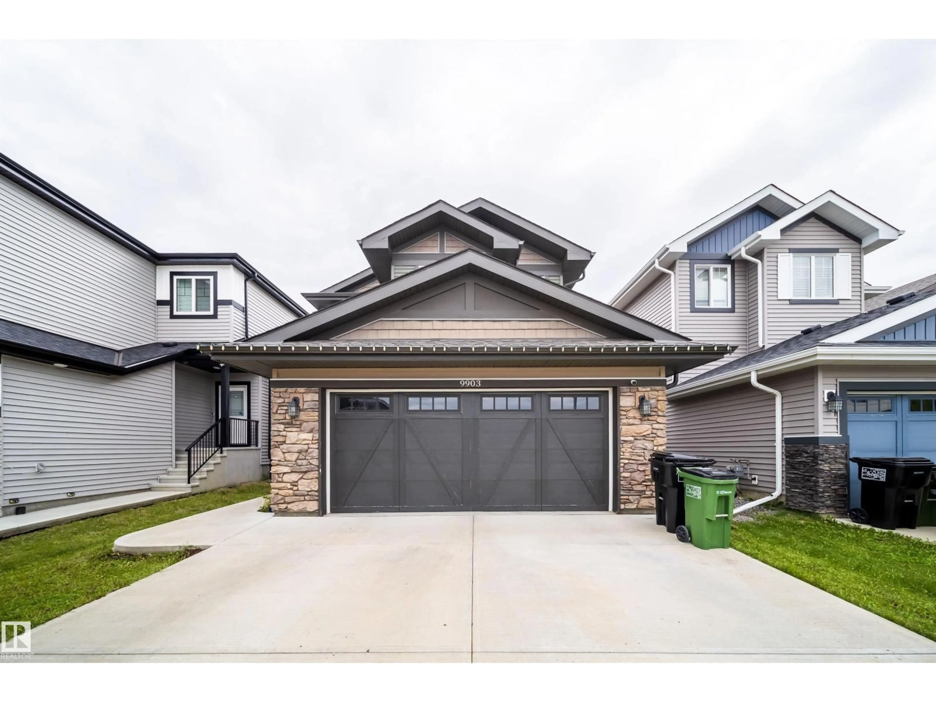 Home with vinyl exterior material, street for NW - 9903 222 ST, Edmonton Alberta T5T7J1