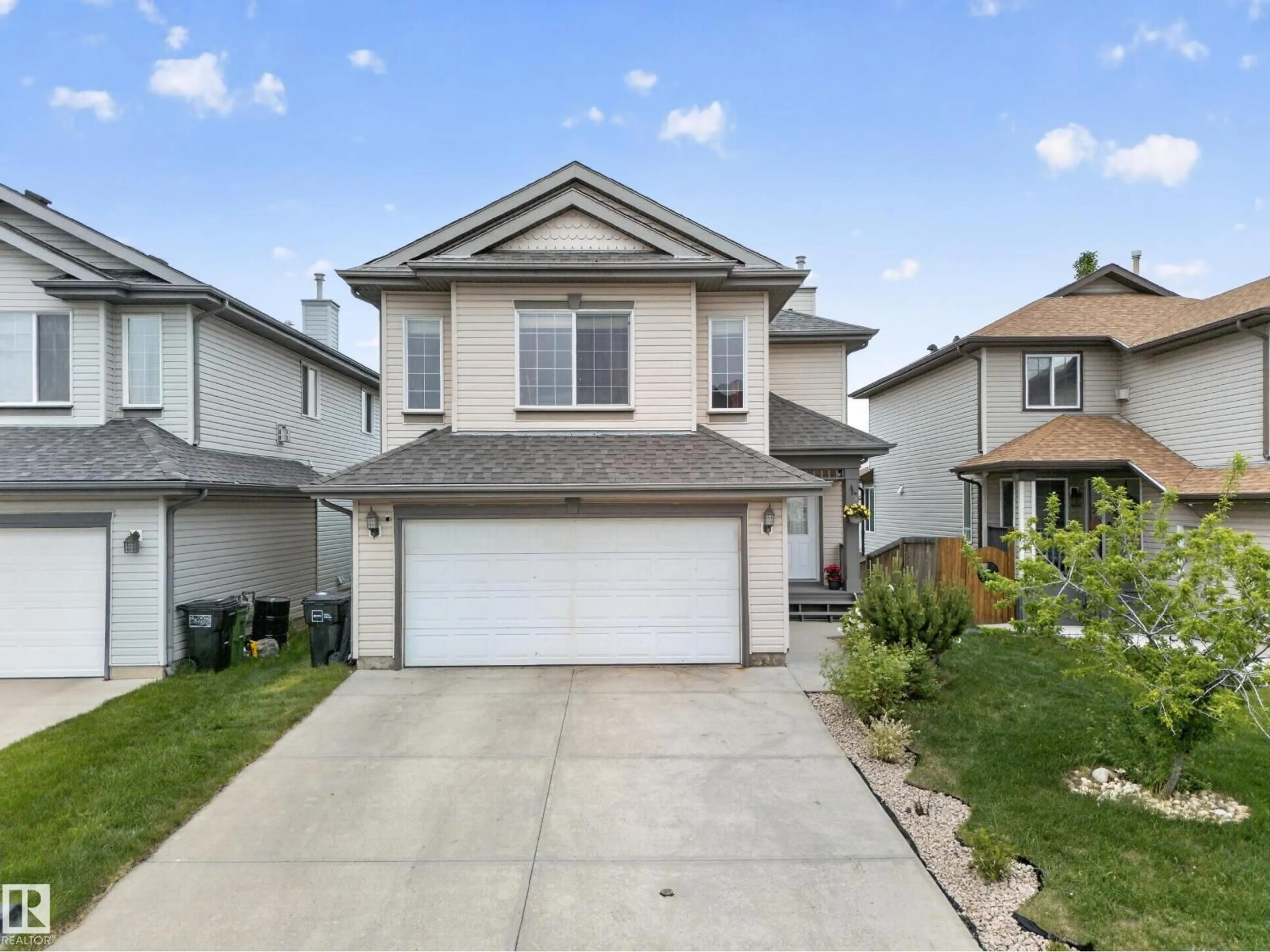 Home with vinyl exterior material, street for NW - 2518 33A AV, Edmonton Alberta T6T1Z4