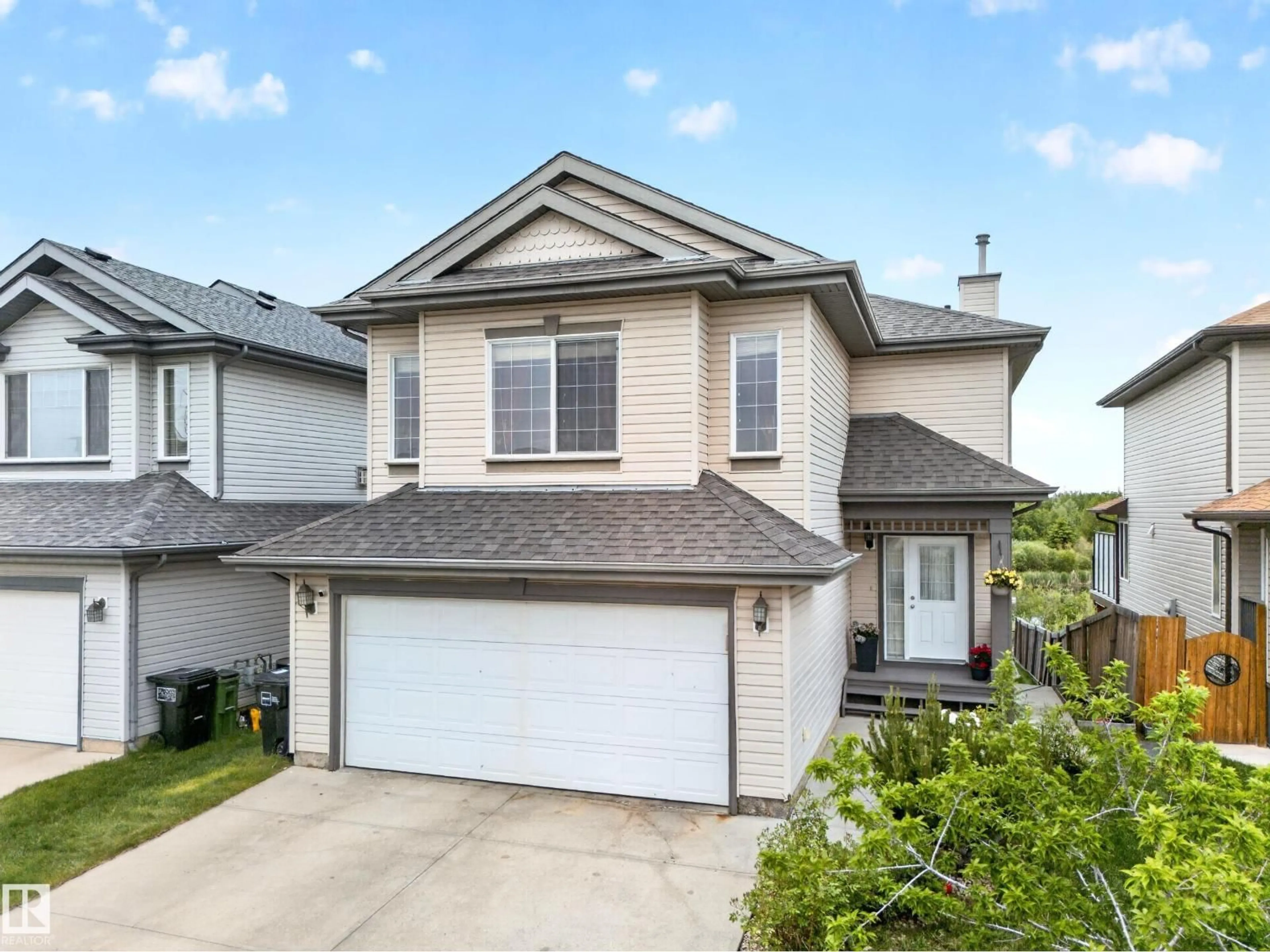 Home with vinyl exterior material, street for NW - 2518 33A AV, Edmonton Alberta T6T1Z4