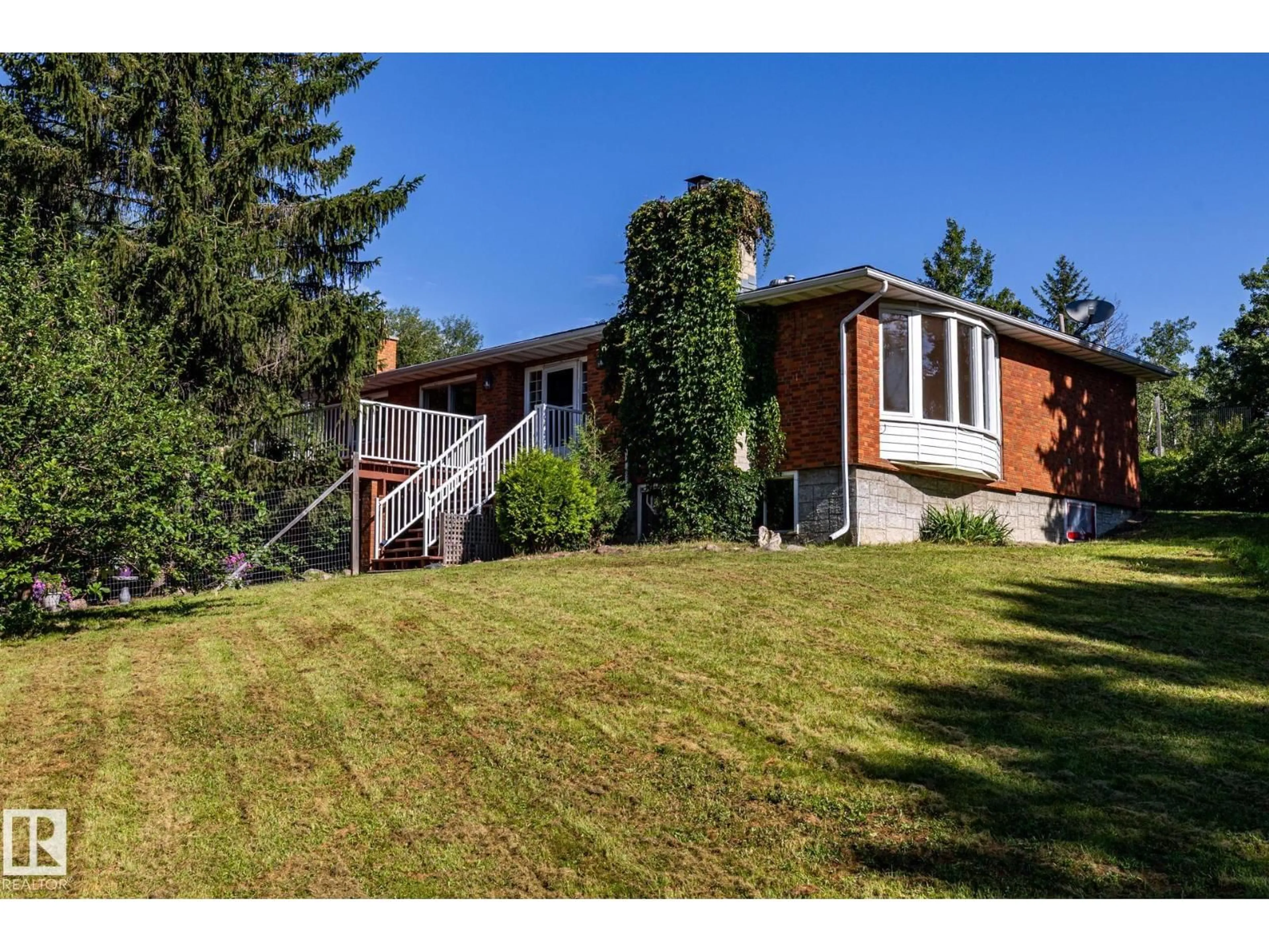 A pic from outside/outdoor area/front of a property/back of a property/a pic from drone, mountain view for 22051 - 86 TWP ROAD 530 ROAD, Rural Strathcona County Alberta T8E2C4