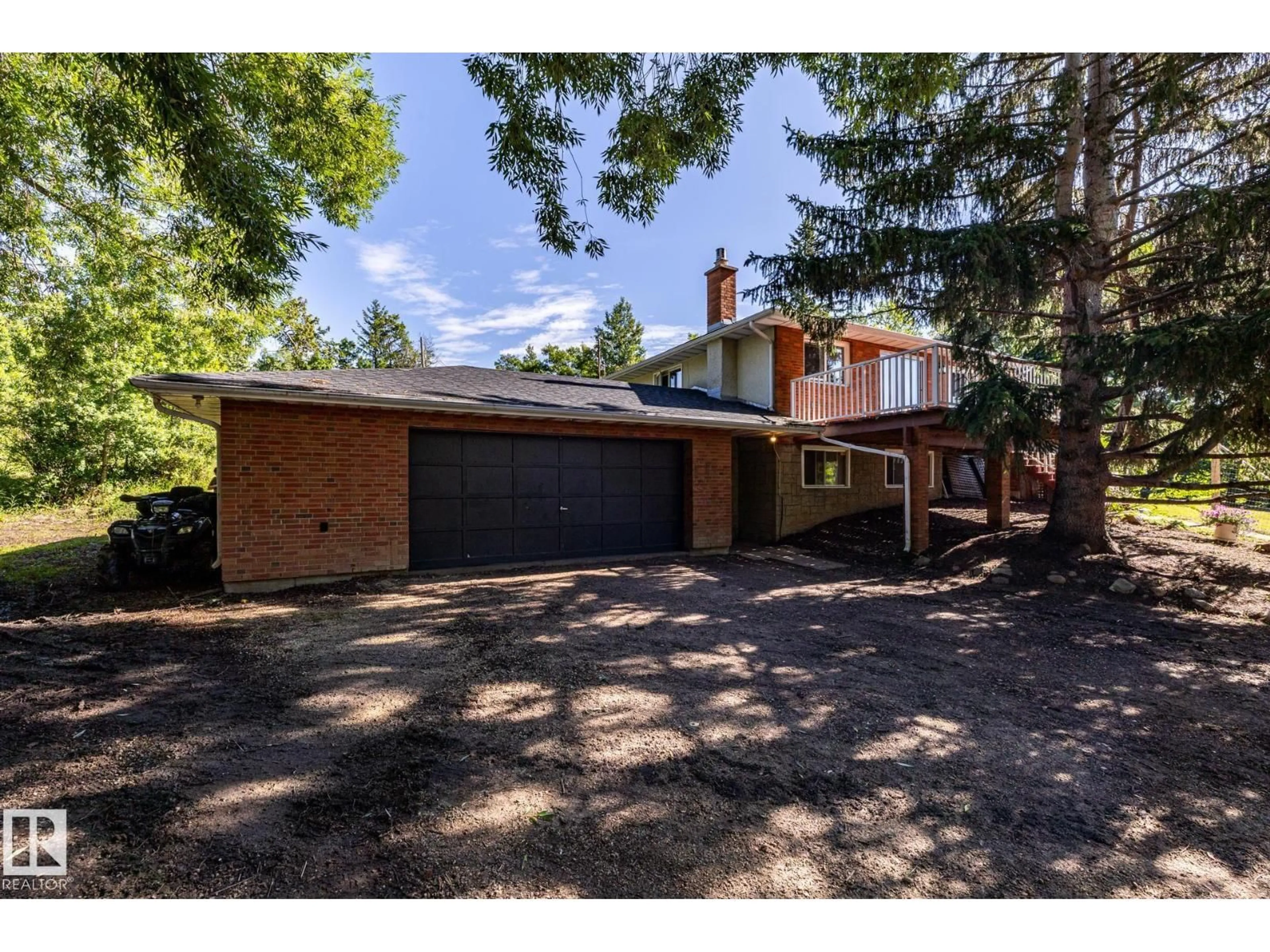 Home with brick exterior material, street for 22051 - 86 TWP ROAD 530 ROAD, Rural Strathcona County Alberta T8E2C4