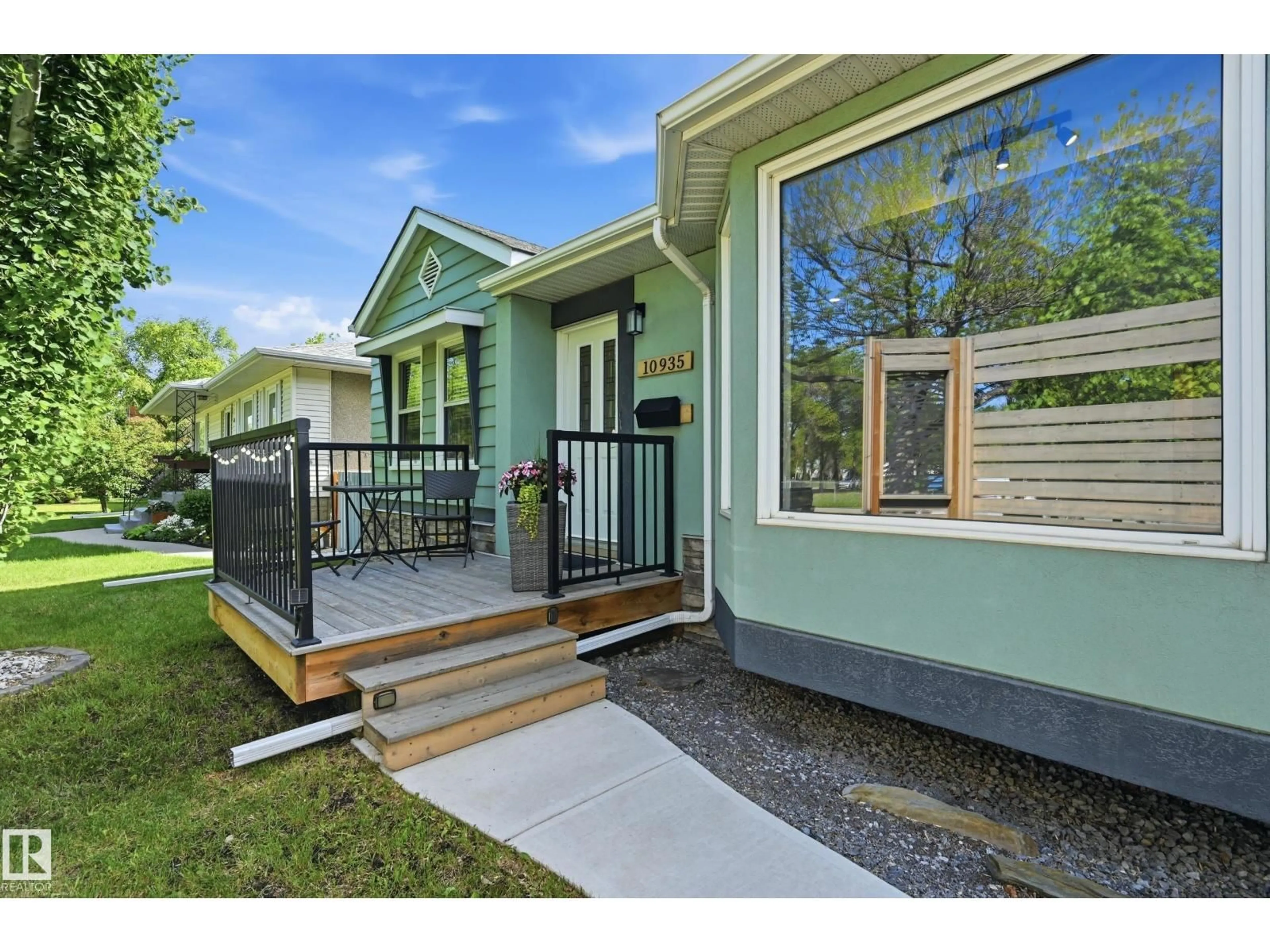 Home with vinyl exterior material, street for NW - 10935 127 ST, Edmonton Alberta T5M0S8