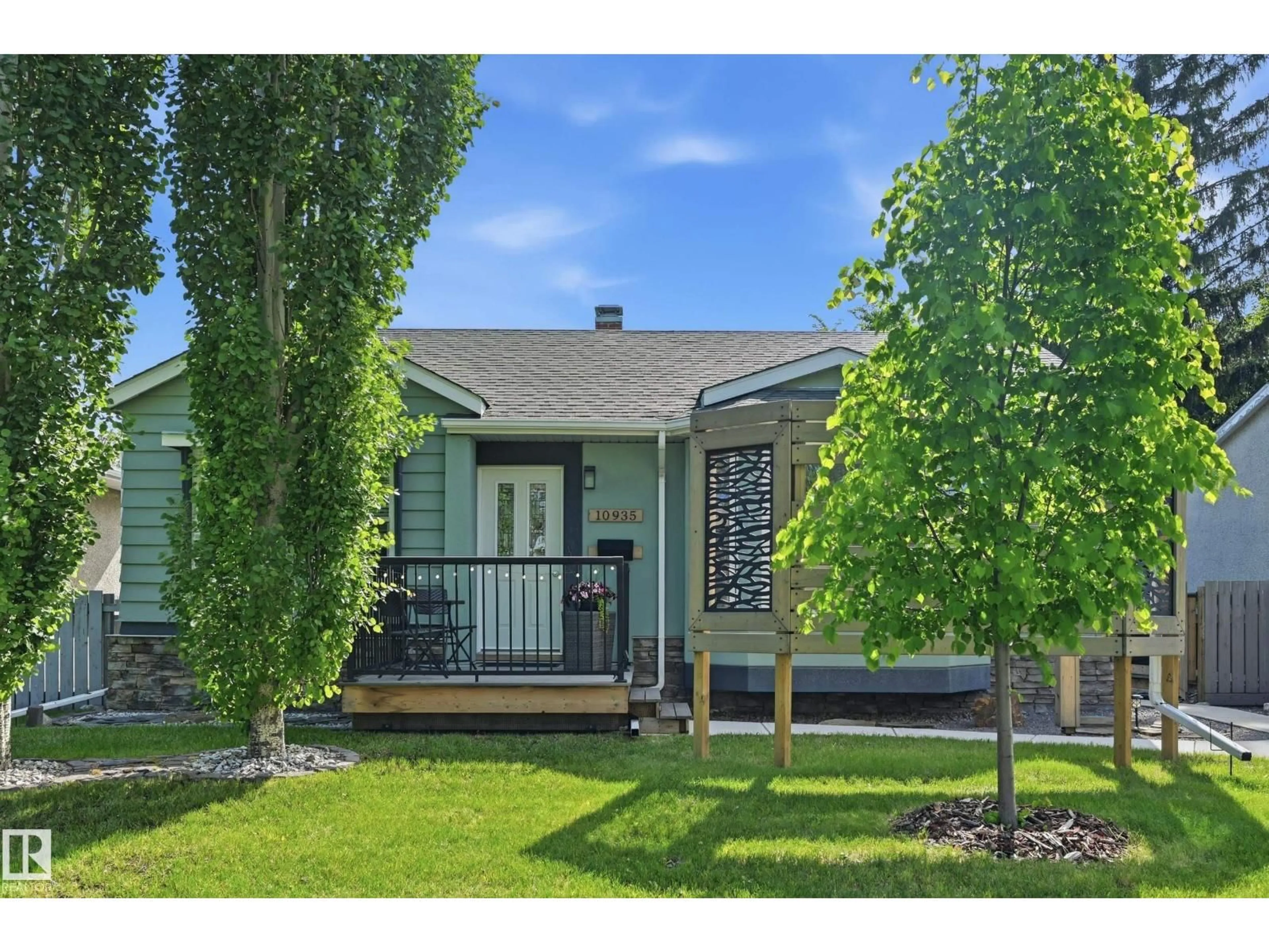 Home with vinyl exterior material, street for NW - 10935 127 ST, Edmonton Alberta T5M0S8