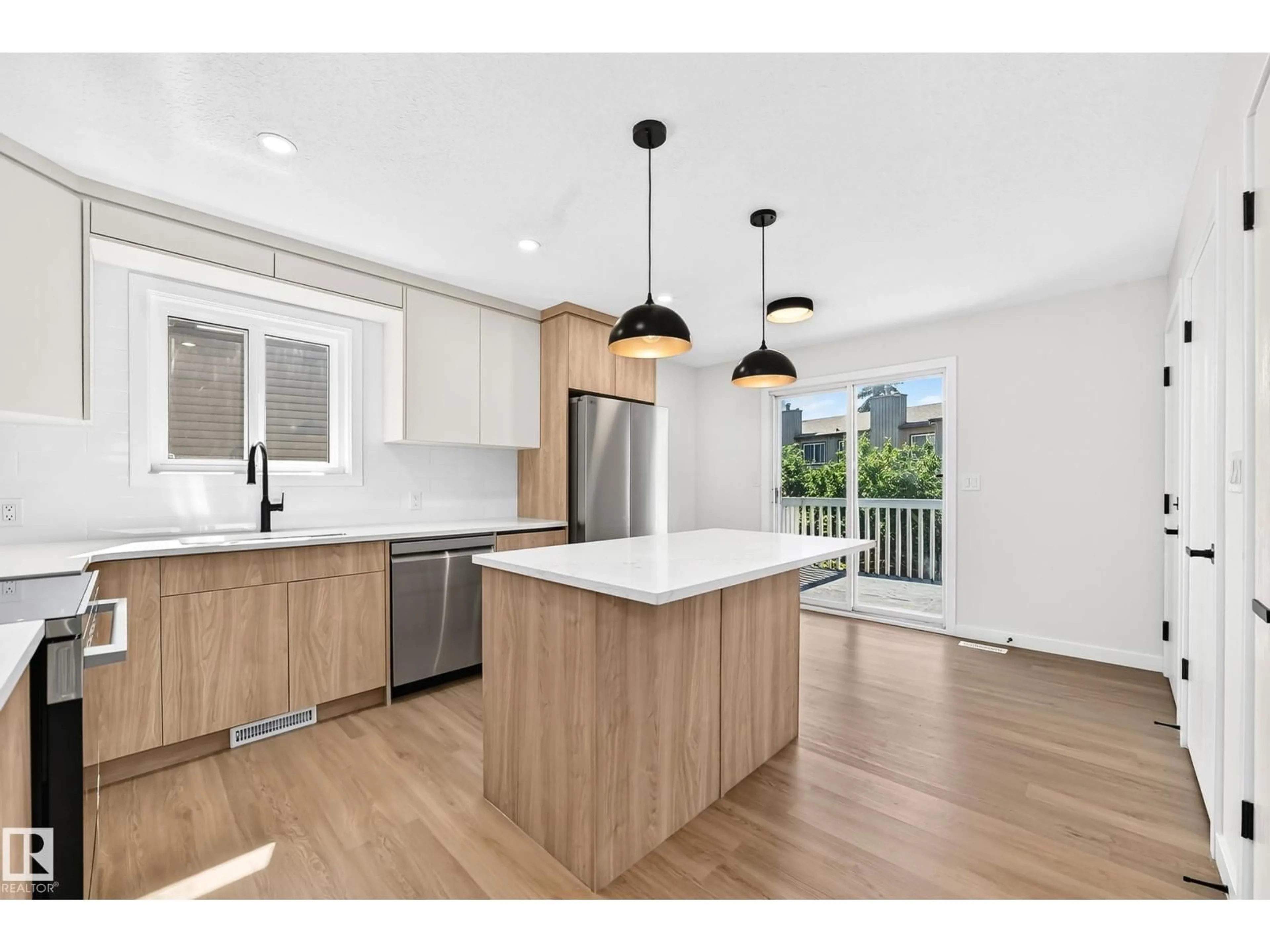 Open concept kitchen, wood/laminate floor for NW - 17816 94 ST, Edmonton Alberta T5Z2G9