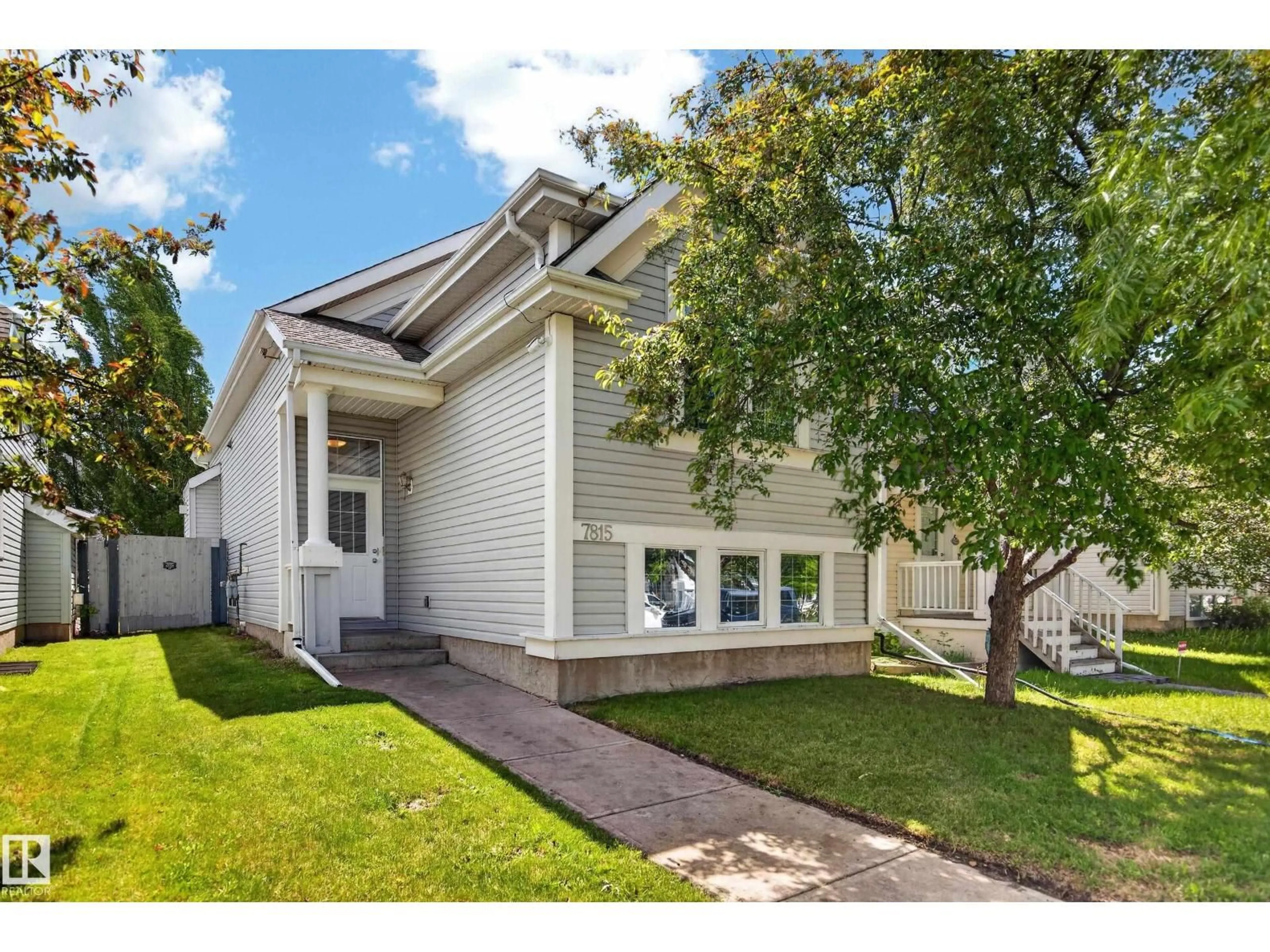 Home with vinyl exterior material, street for 7815 14 AV, Edmonton Alberta T6X1H3