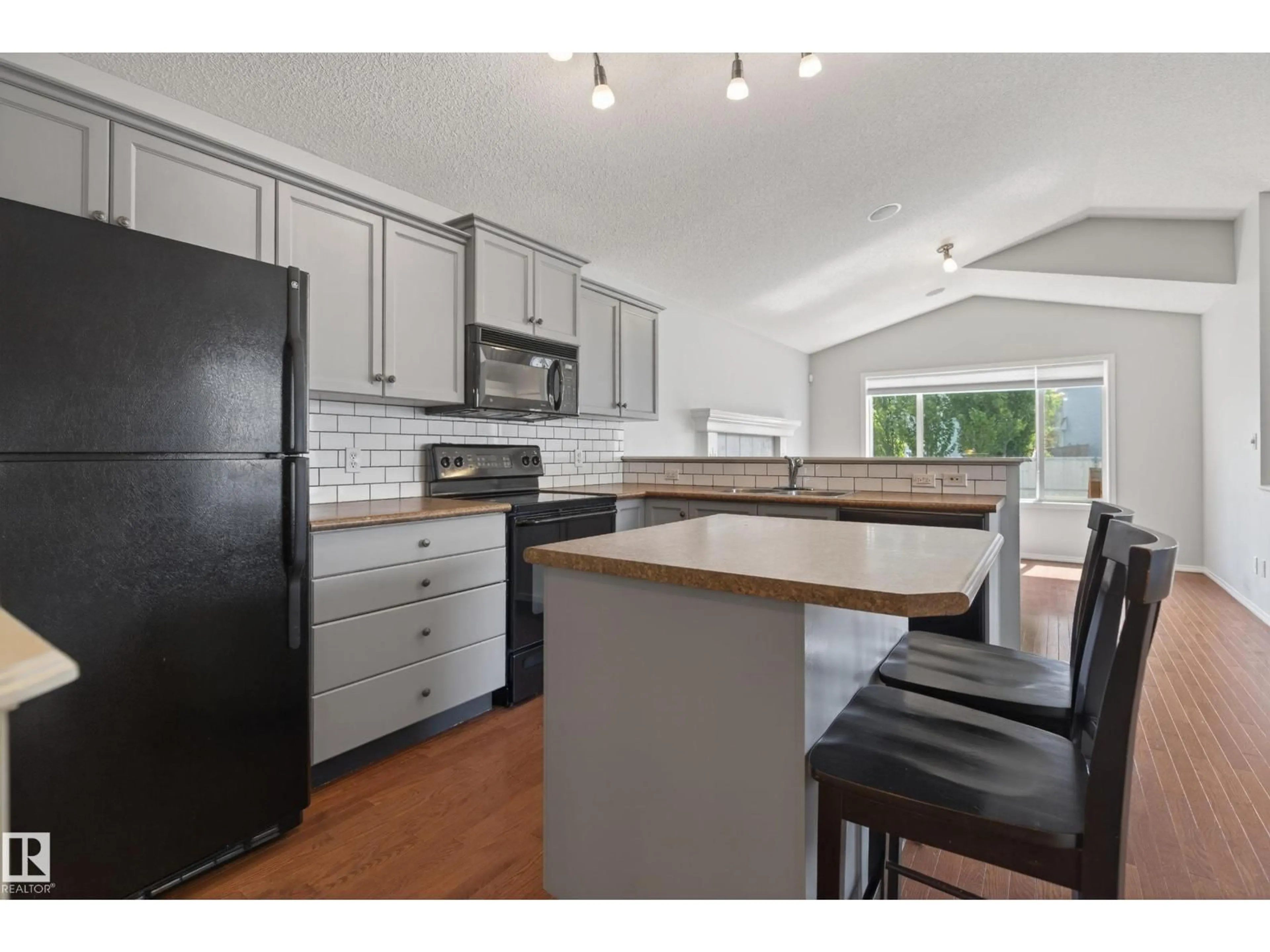 Open concept kitchen, unknown for 7815 14 AV, Edmonton Alberta T6X1H3