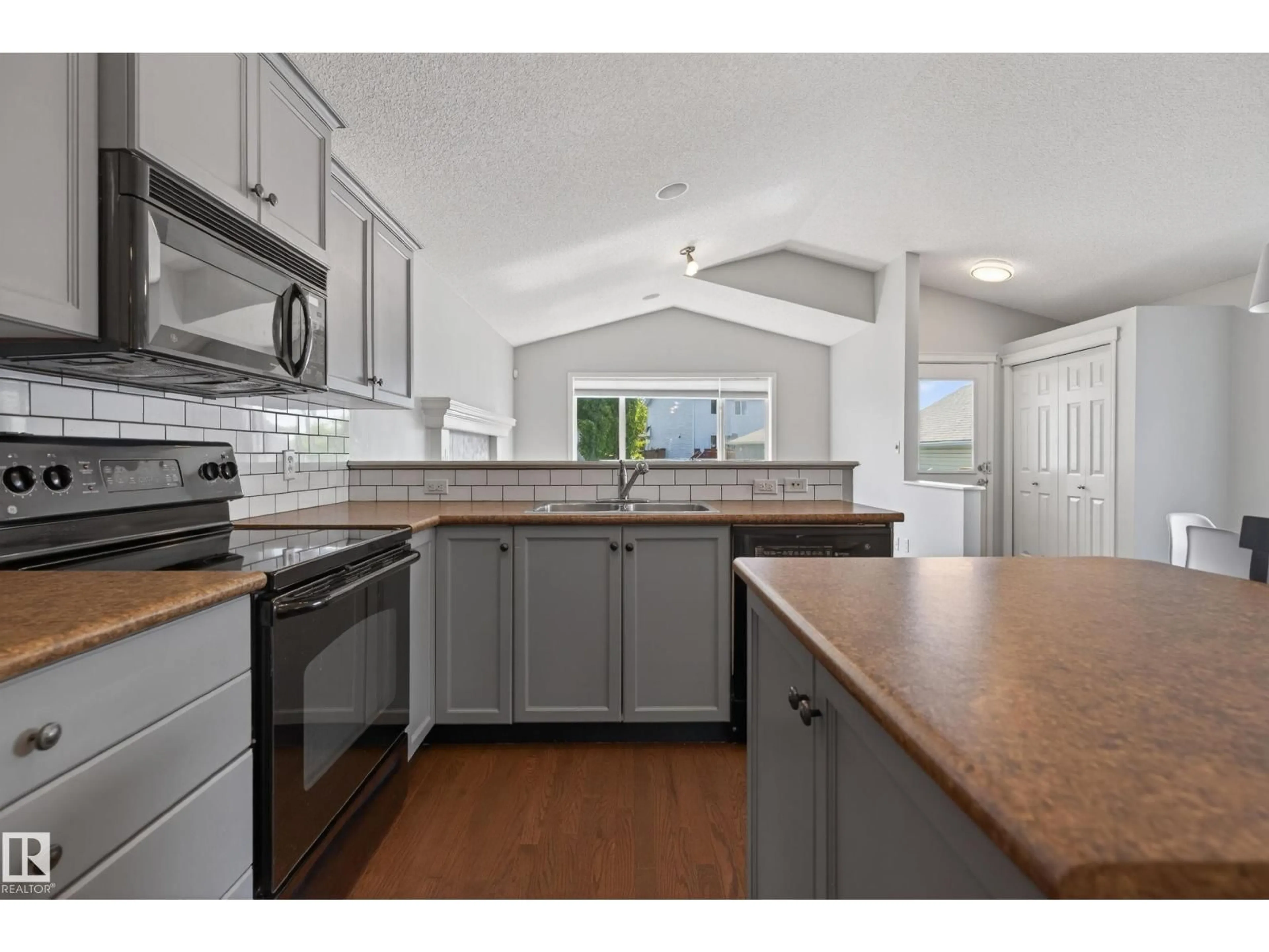 Open concept kitchen, unknown for 7815 14 AV, Edmonton Alberta T6X1H3