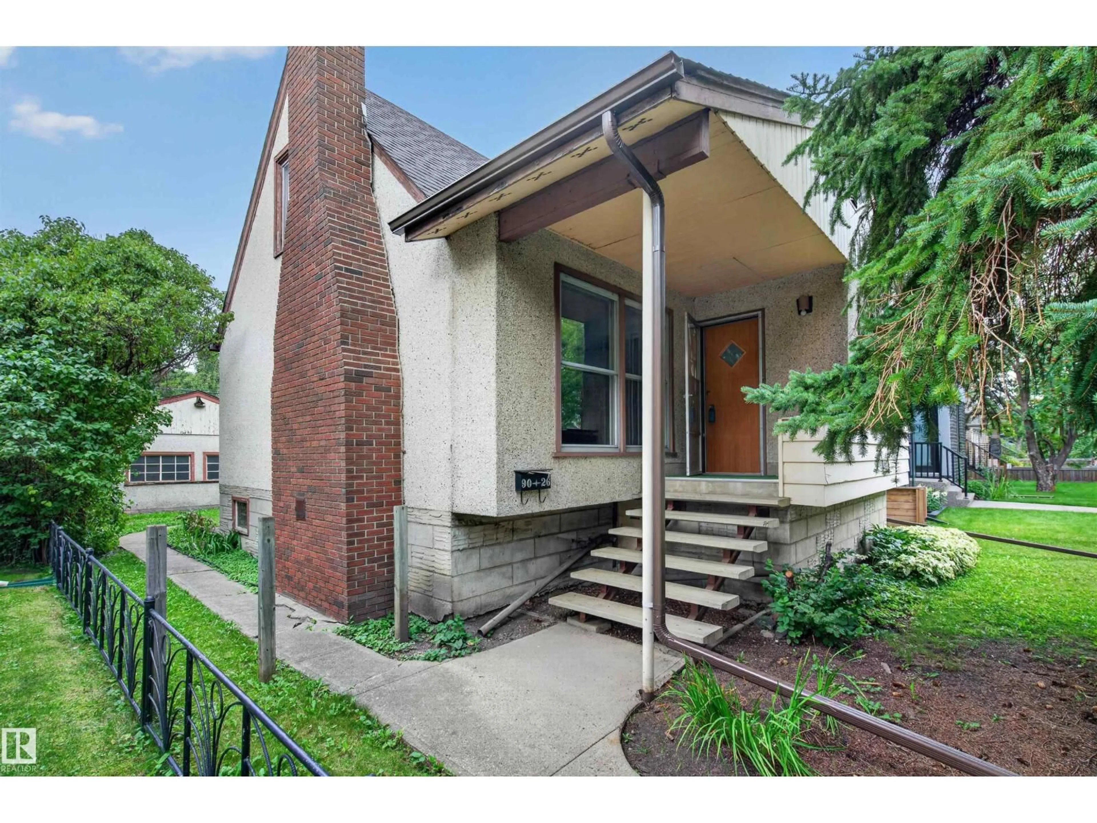 Home with brick exterior material, street for 9026 92 ST, Edmonton Alberta T6C3R2