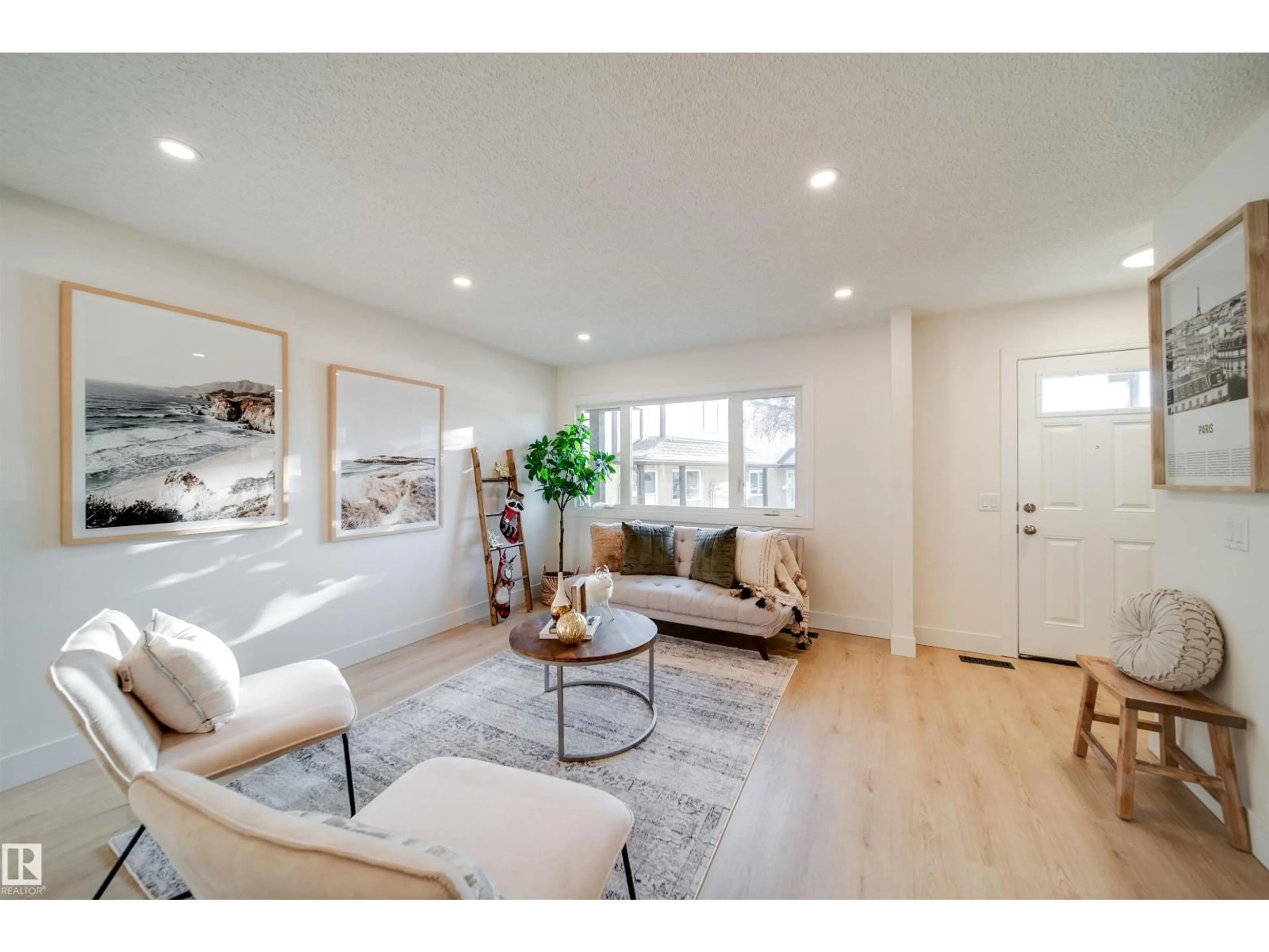 Living room with furniture, wood/laminate floor for NW - 18 14511 52 ST, Edmonton Alberta T5A4M6