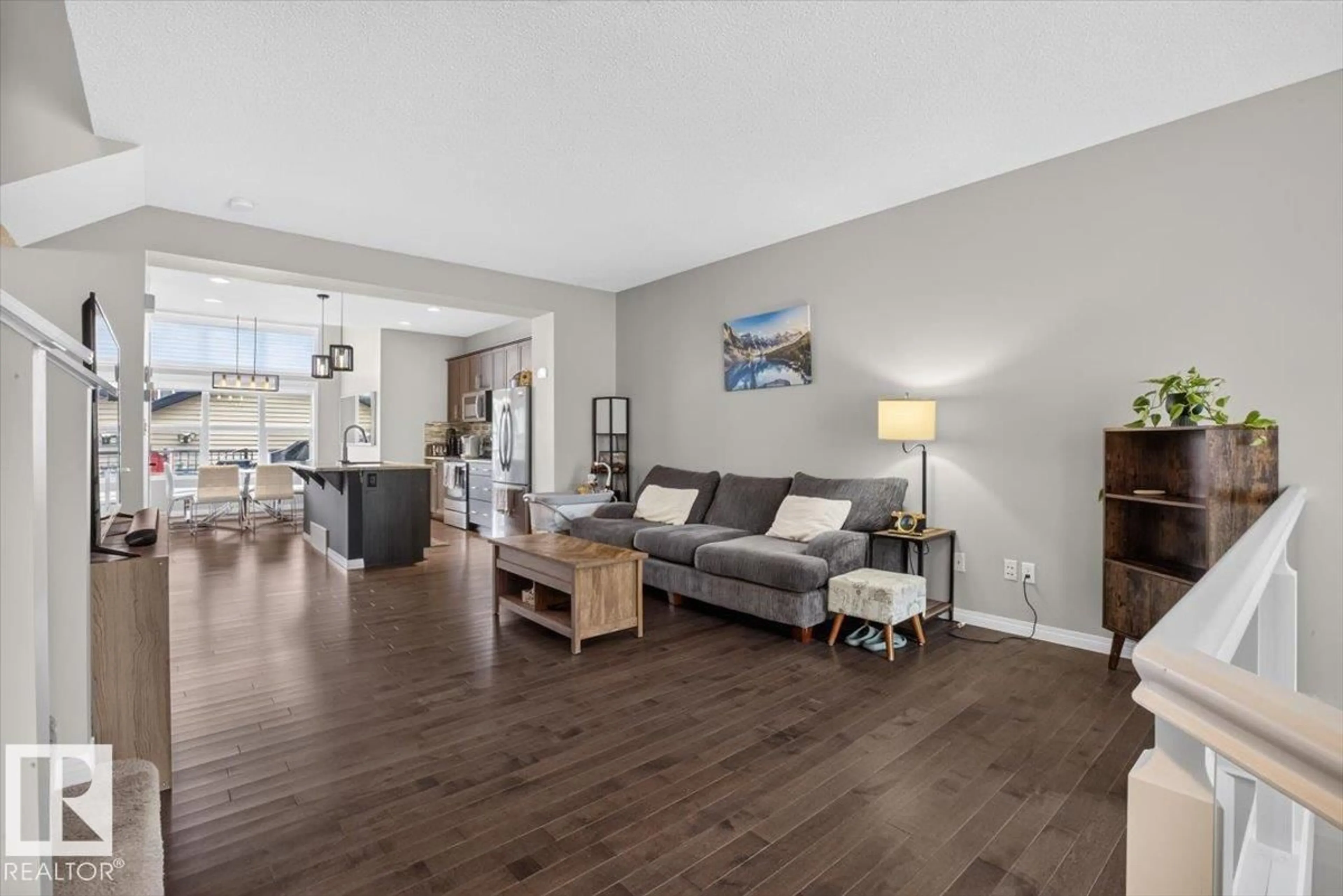 Living room with furniture, wood/laminate floor for 3124 PAISLEY RD, Edmonton Alberta T6W2W8