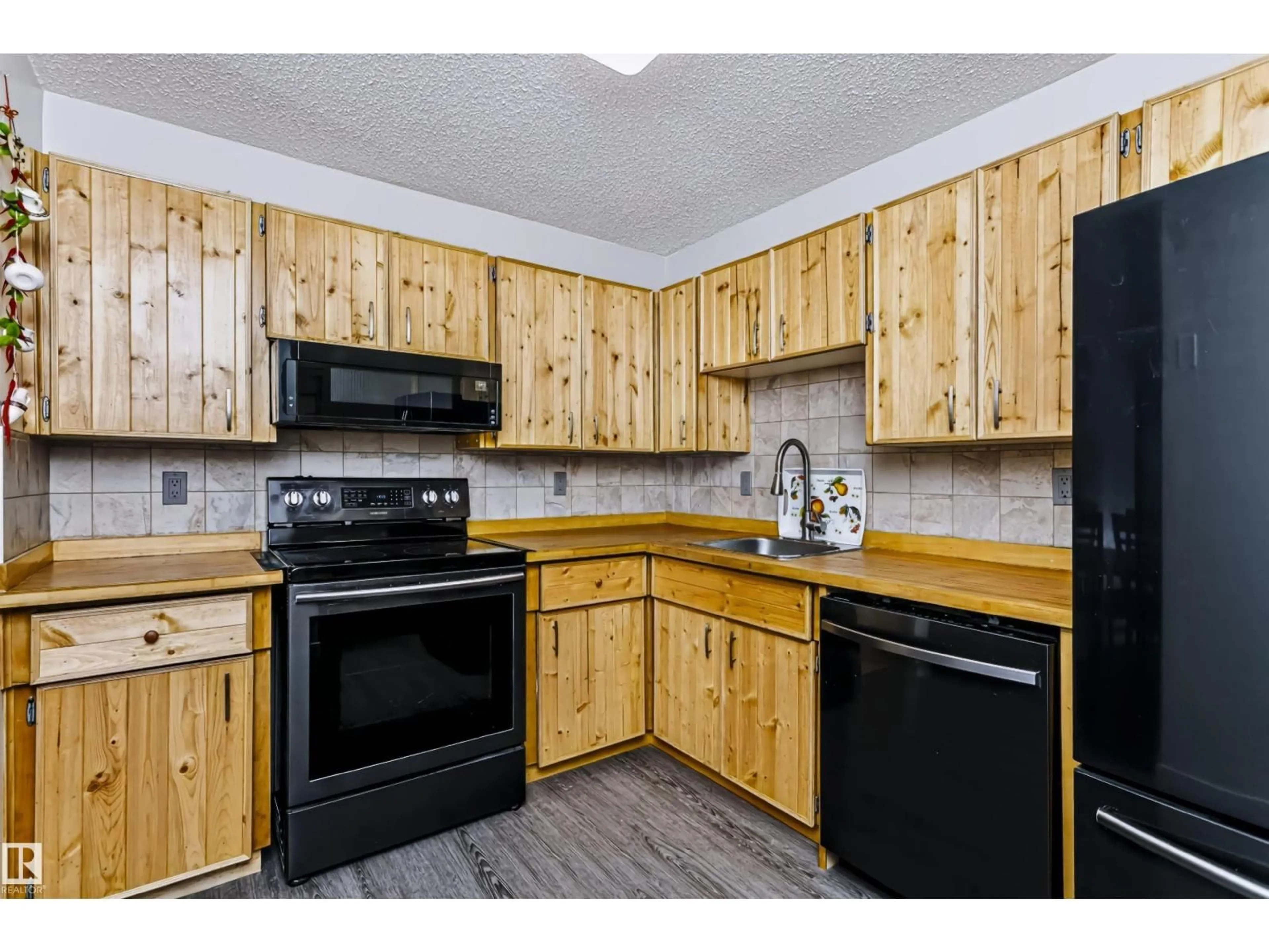 Standard kitchen, wood/laminate floor for #208 - 9810 178 ST NW, Edmonton Alberta T5T3H4