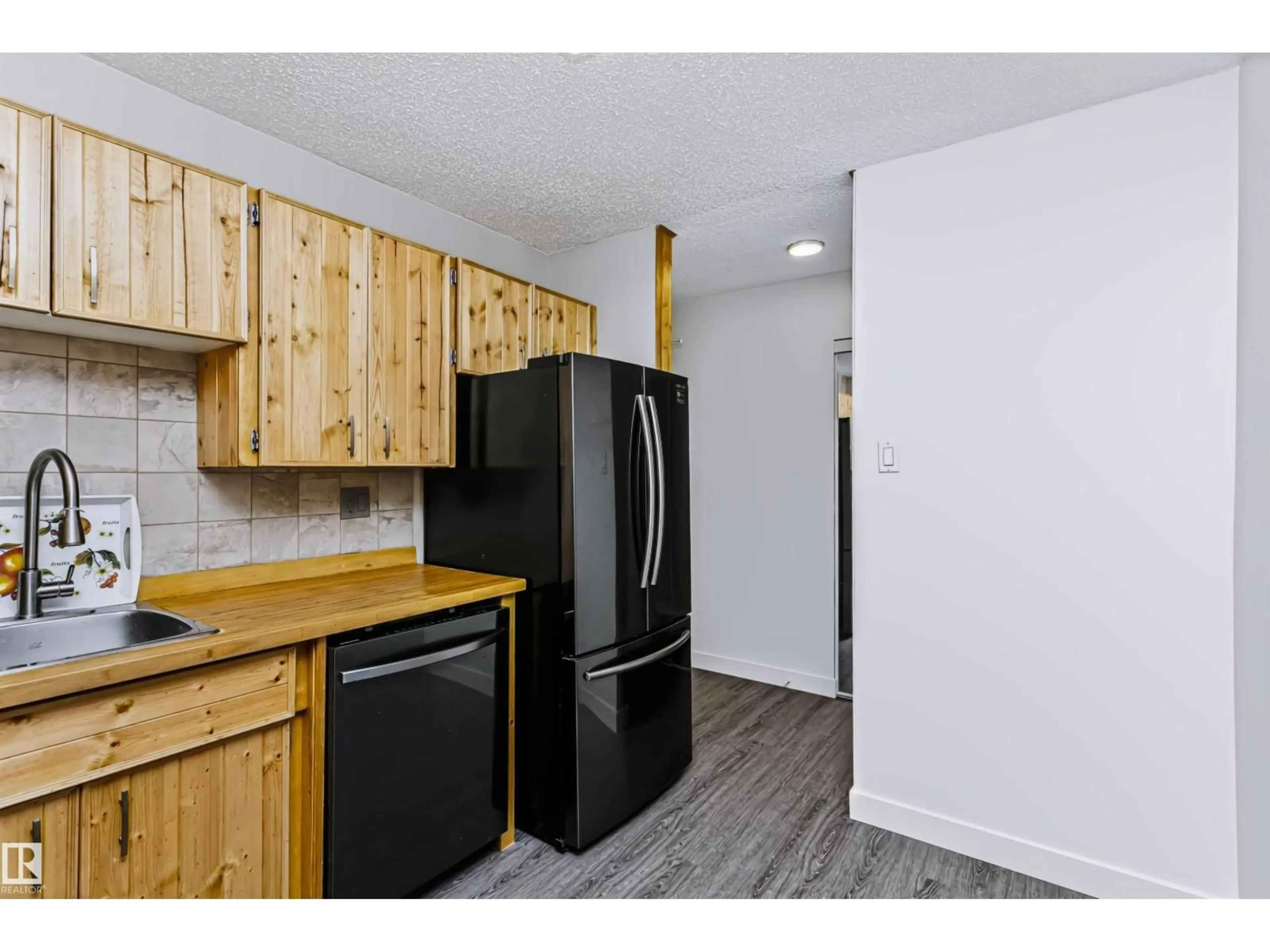 Standard kitchen, wood/laminate floor for #208 - 9810 178 ST NW, Edmonton Alberta T5T3H4