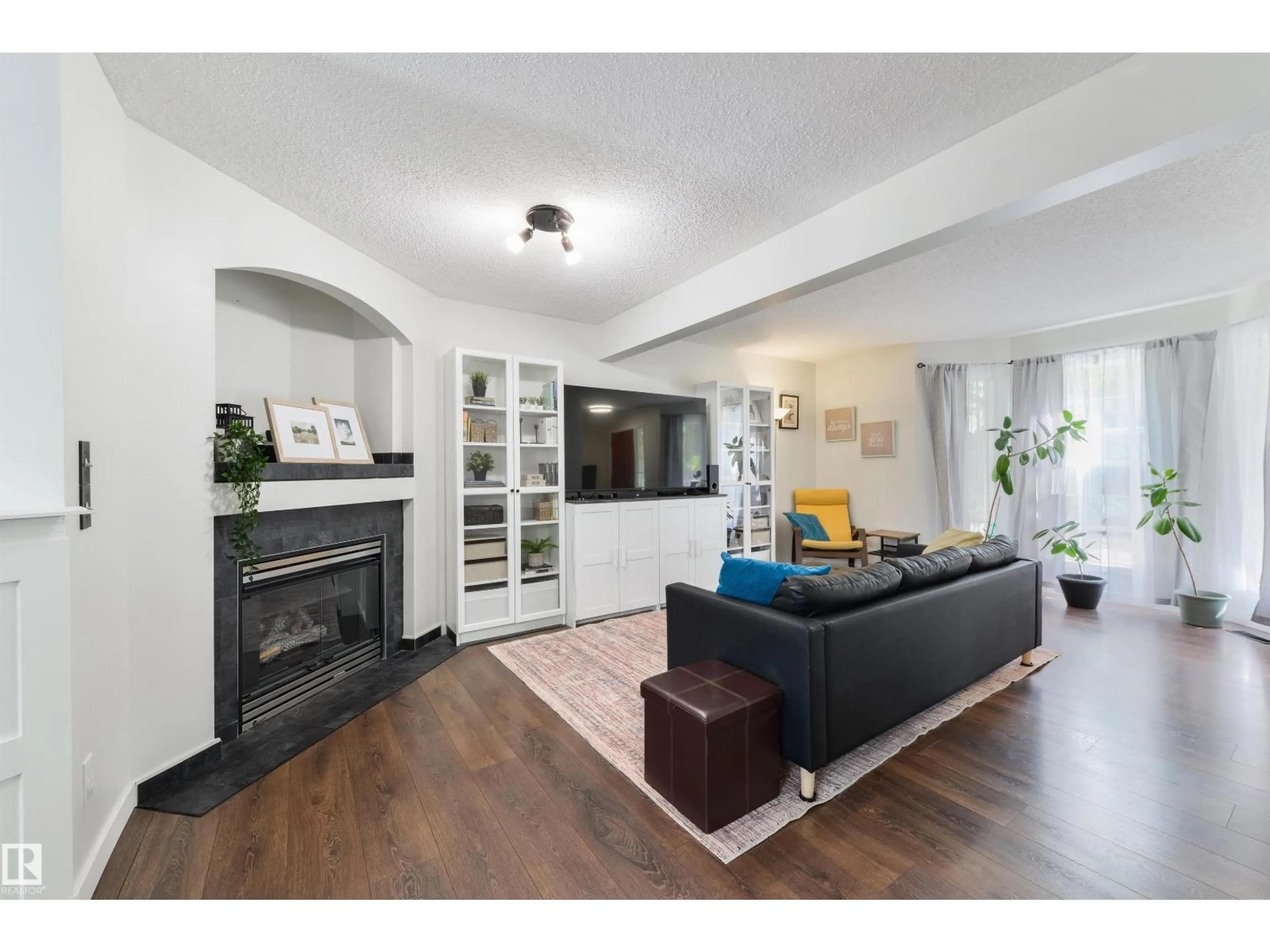 Living room with furniture, wood/laminate floor for 4790 TERWILLEGAR CM, Edmonton Alberta T6R3H7