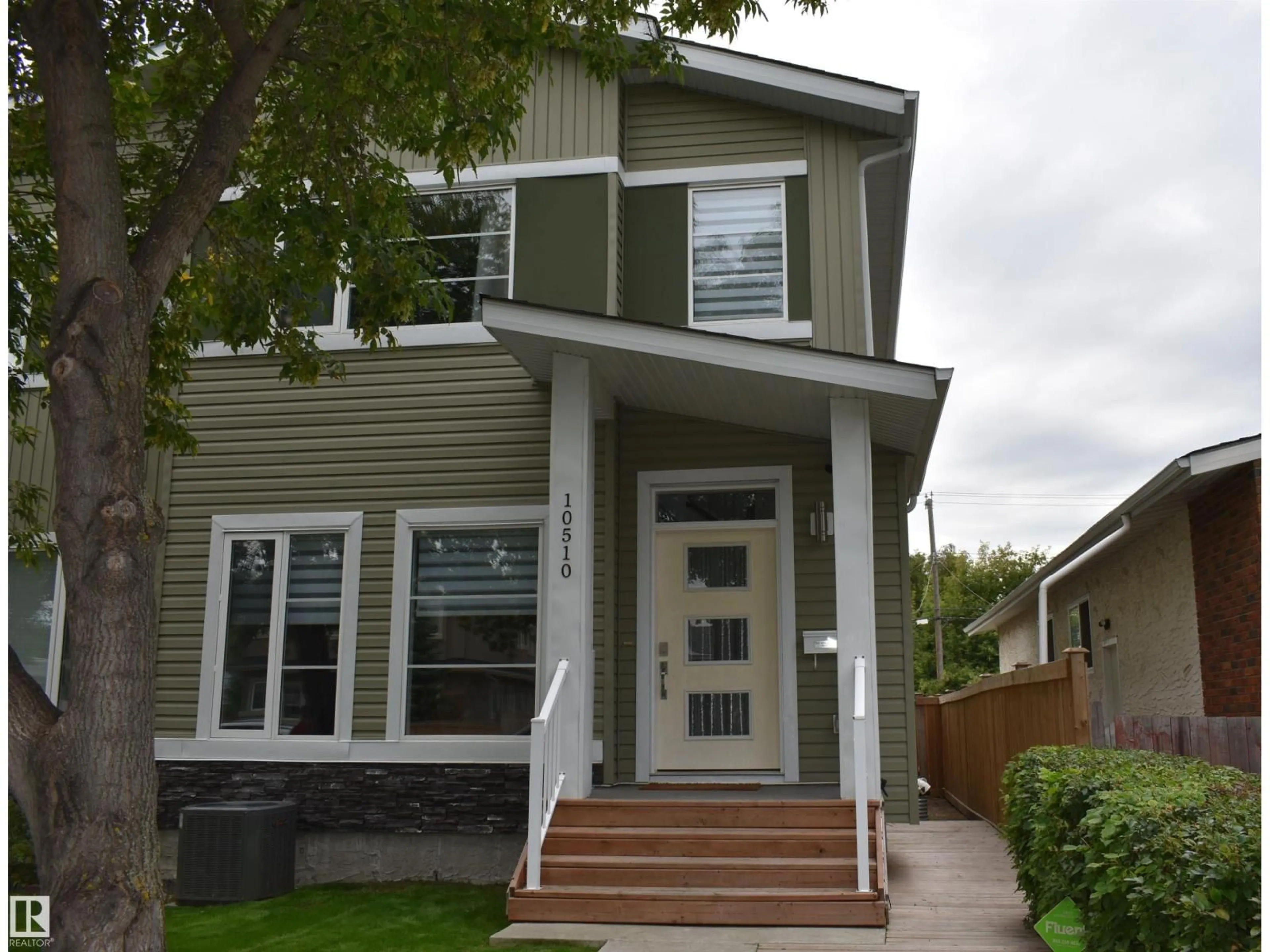 Home with vinyl exterior material, street for NW - 10510 153 ST, Edmonton Alberta T5P2C3