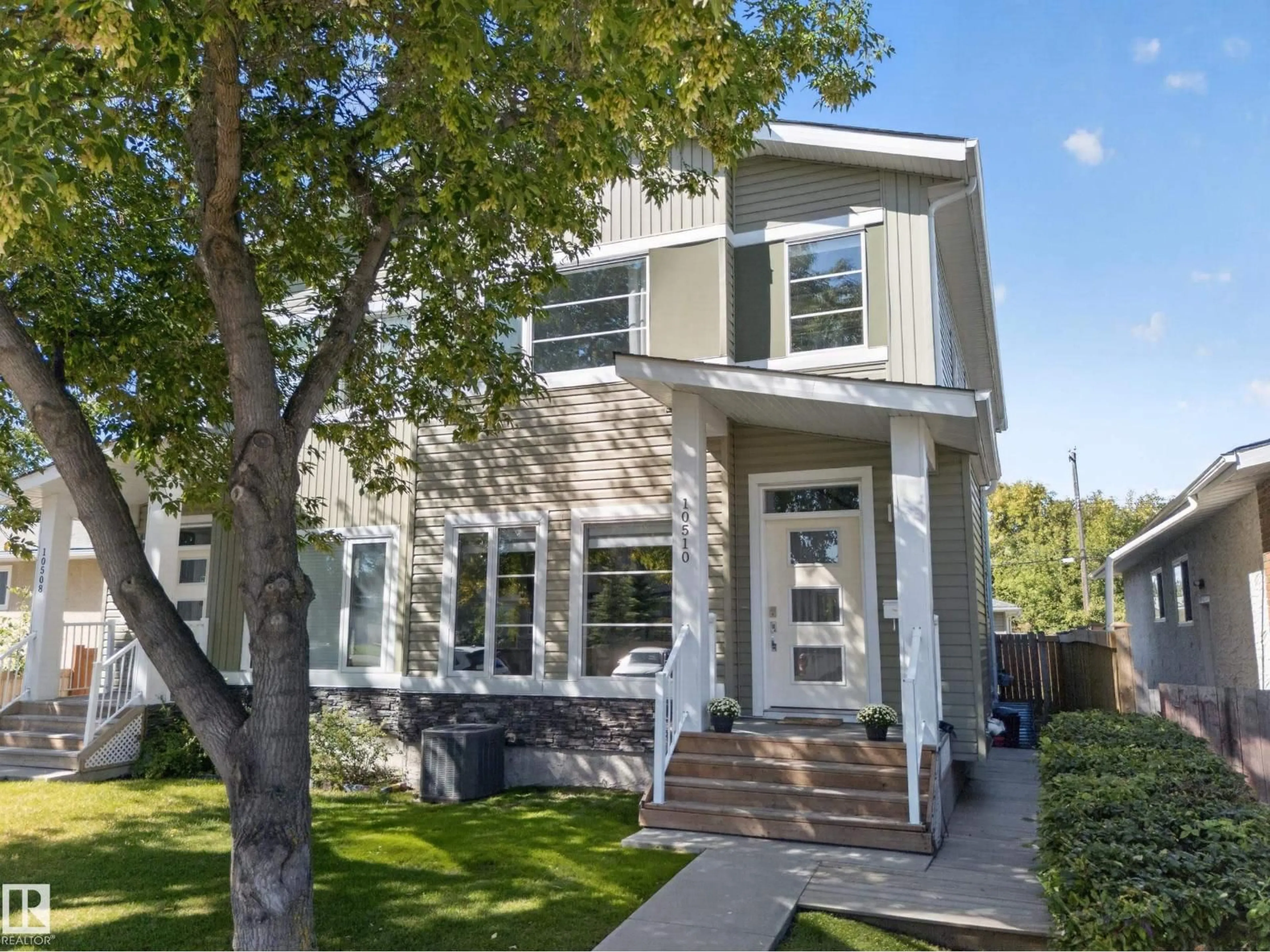 Home with vinyl exterior material, street for NW - 10510 153 ST, Edmonton Alberta T5P2C3