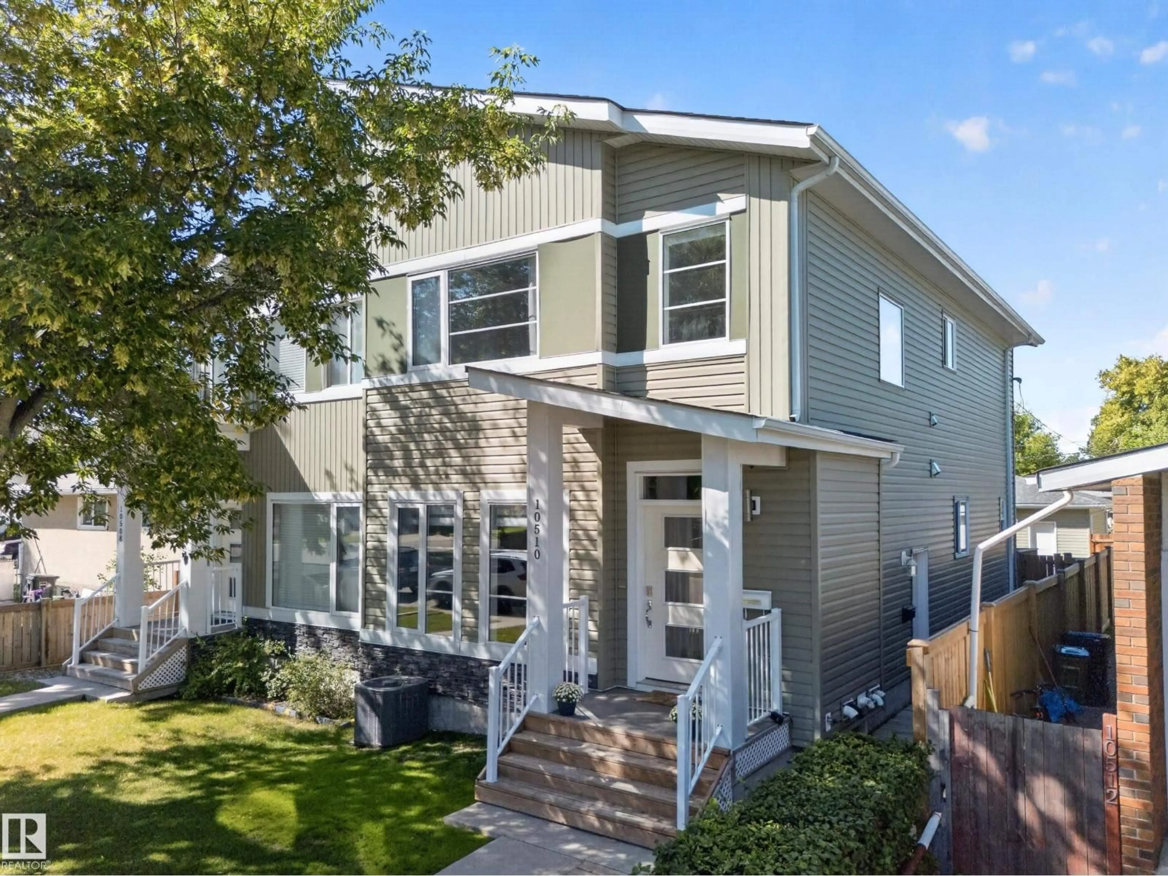 Home with vinyl exterior material, street for NW - 10510 153 ST, Edmonton Alberta T5P2C3