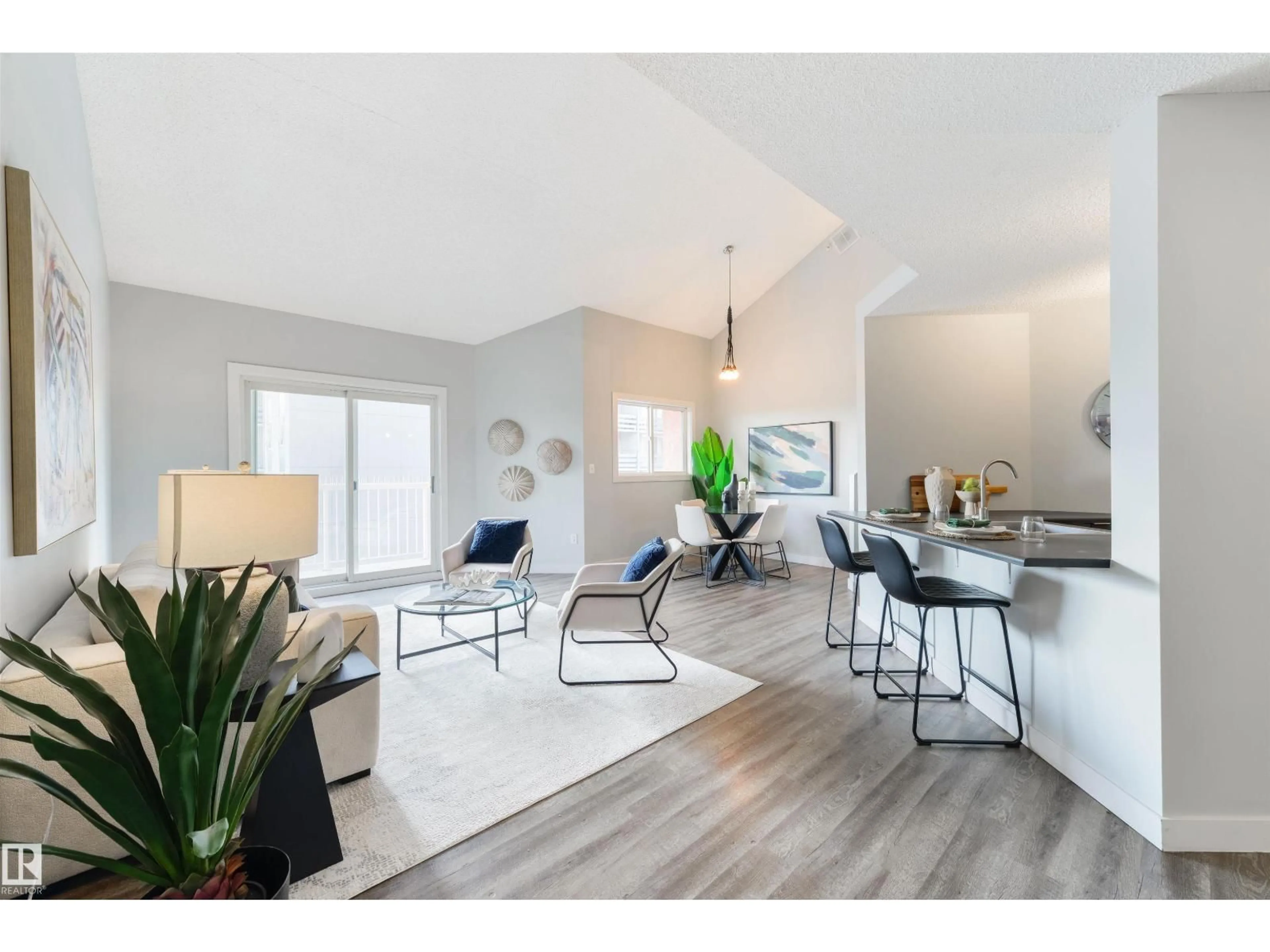 Living room with furniture, wood/laminate floor for #409 - 10153 117 ST, Edmonton Alberta T5K1X5