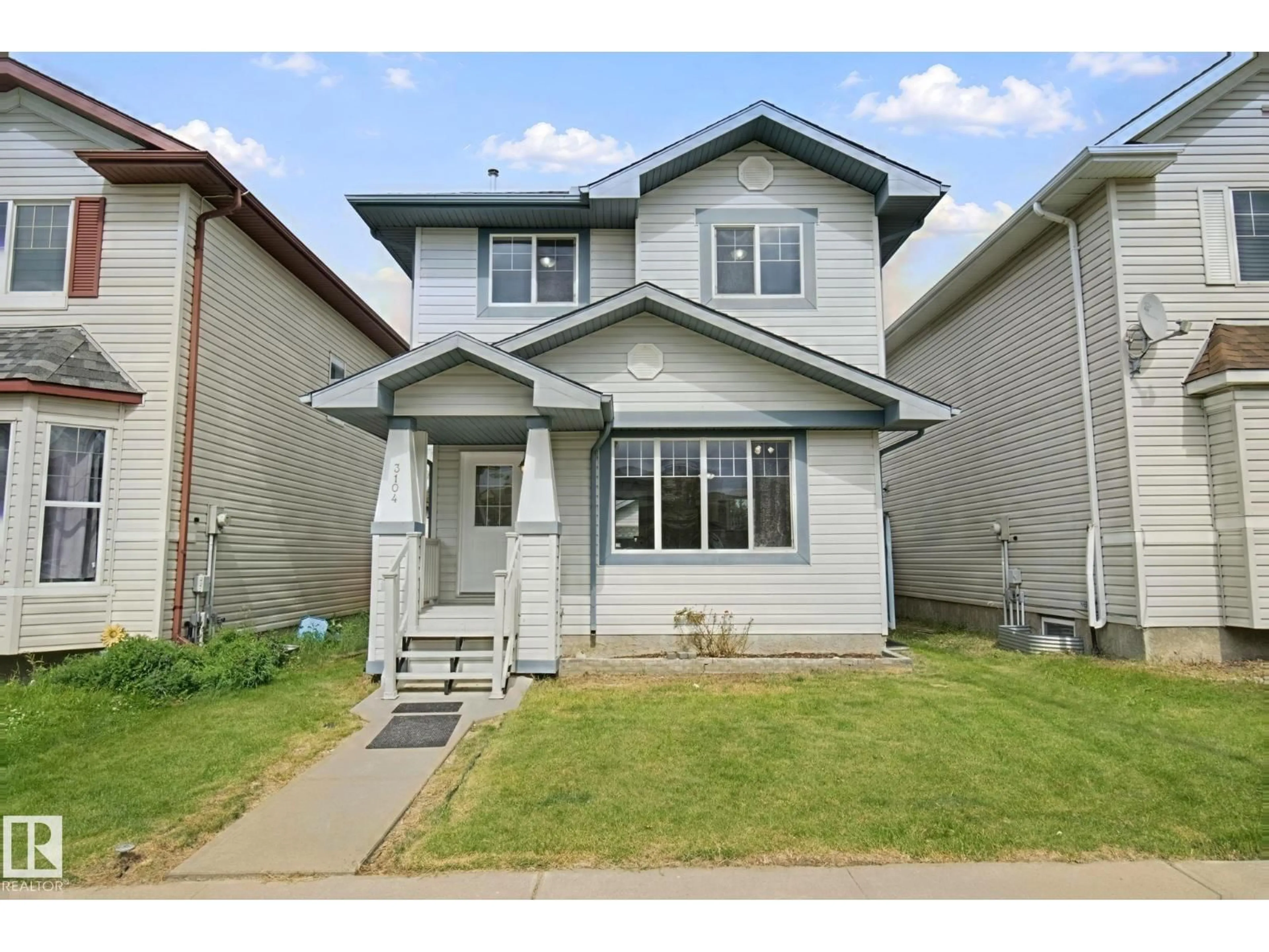 Home with vinyl exterior material, street for 3104 32 AV, Edmonton Alberta T6T1X3