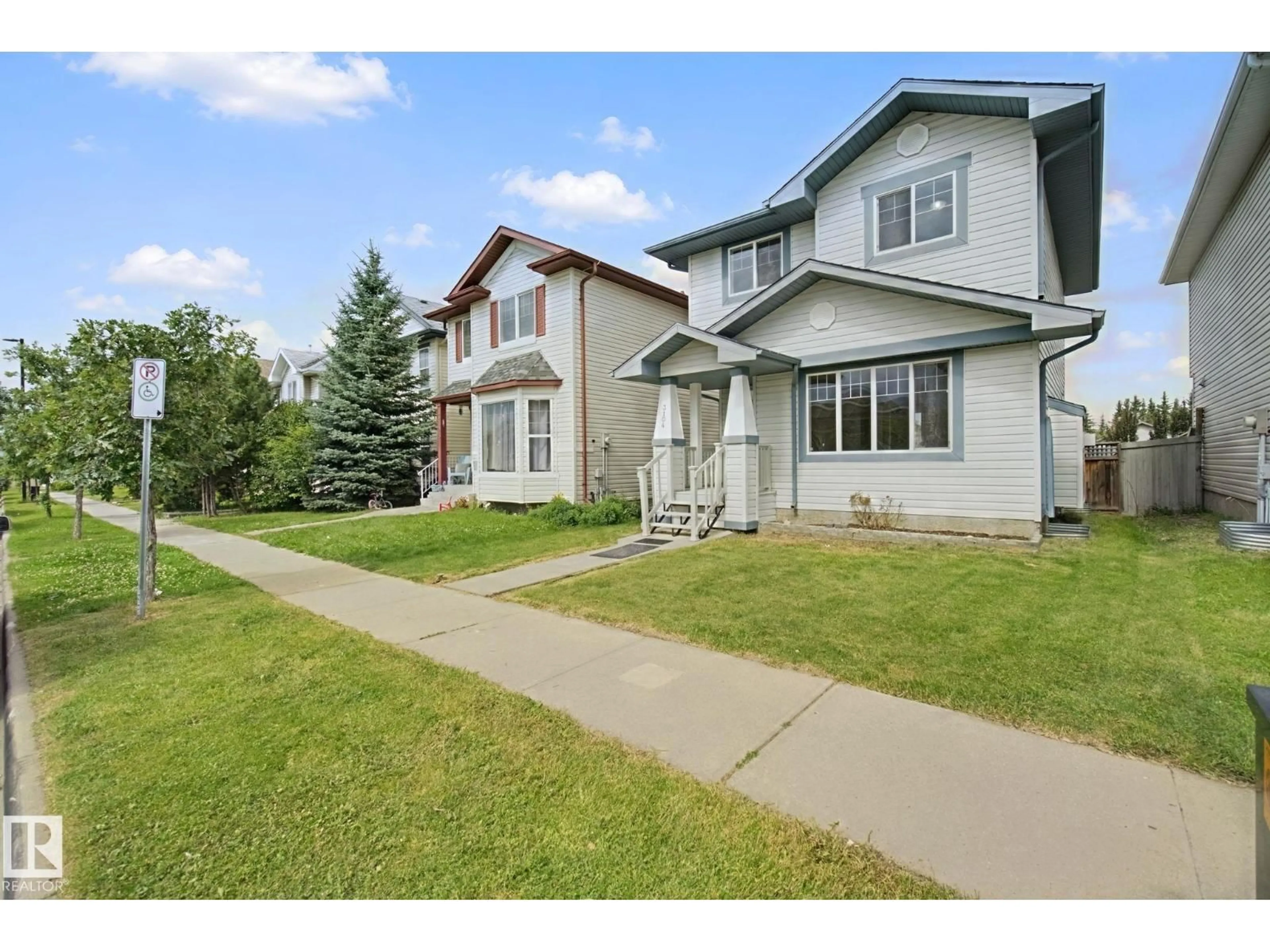 Home with vinyl exterior material, street for 3104 32 AV, Edmonton Alberta T6T1X3