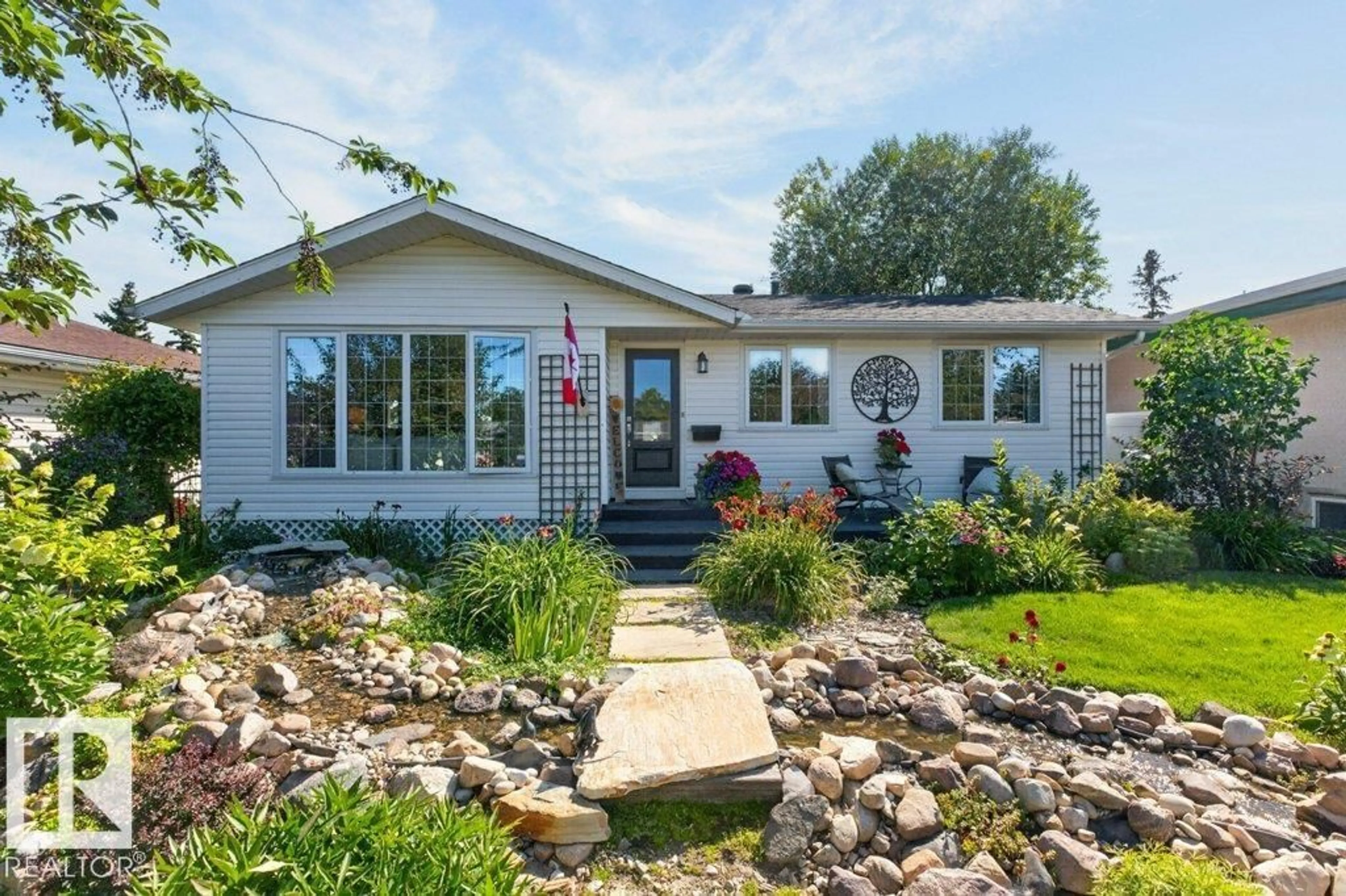 Home with vinyl exterior material, street for 9047 52 ST, Edmonton Alberta T6B1G1